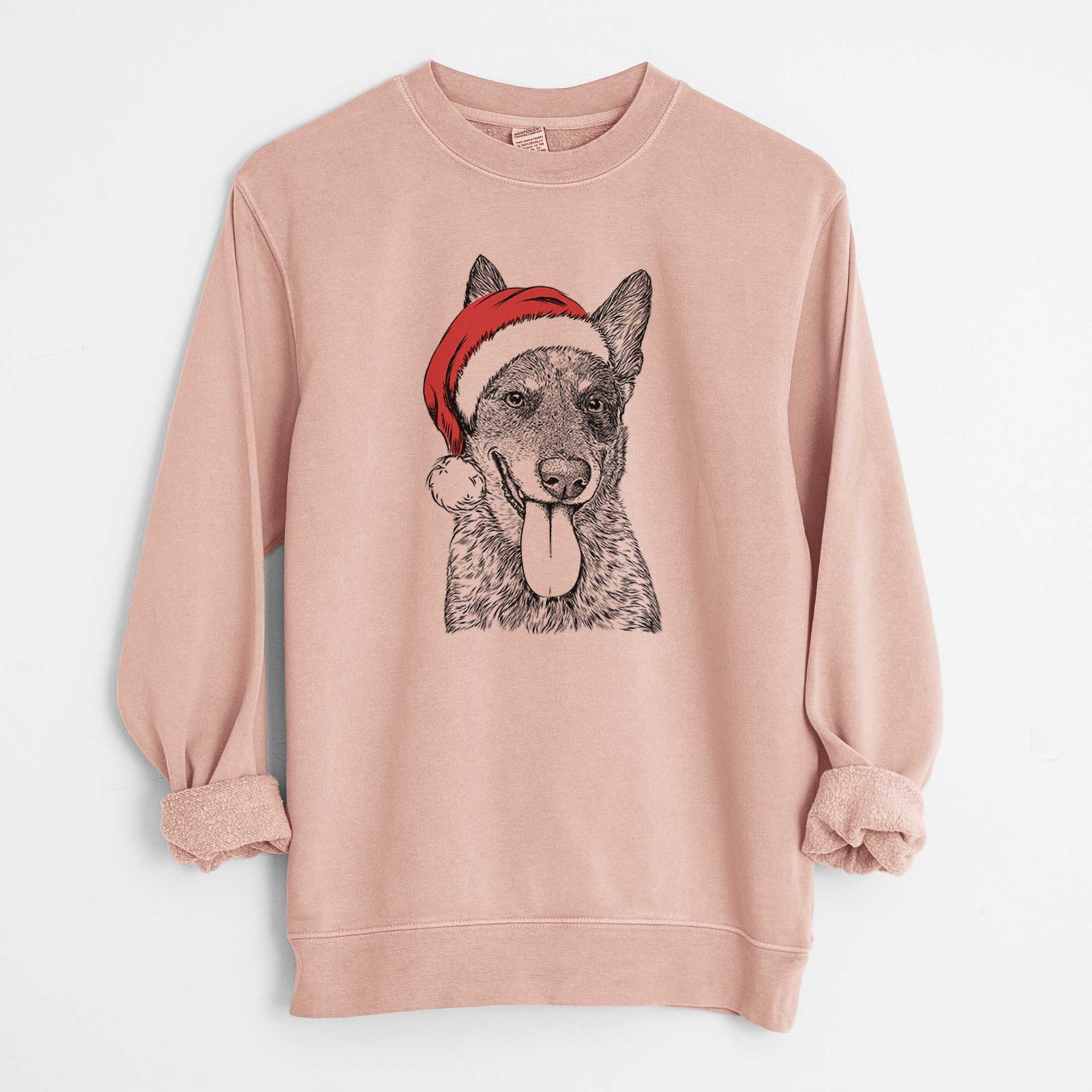Hand-drawn sketch of Madison the Blue Heeler wearing a Santa hat on a Dusty Pink Unisex pigment dyed crew sweatshirt
