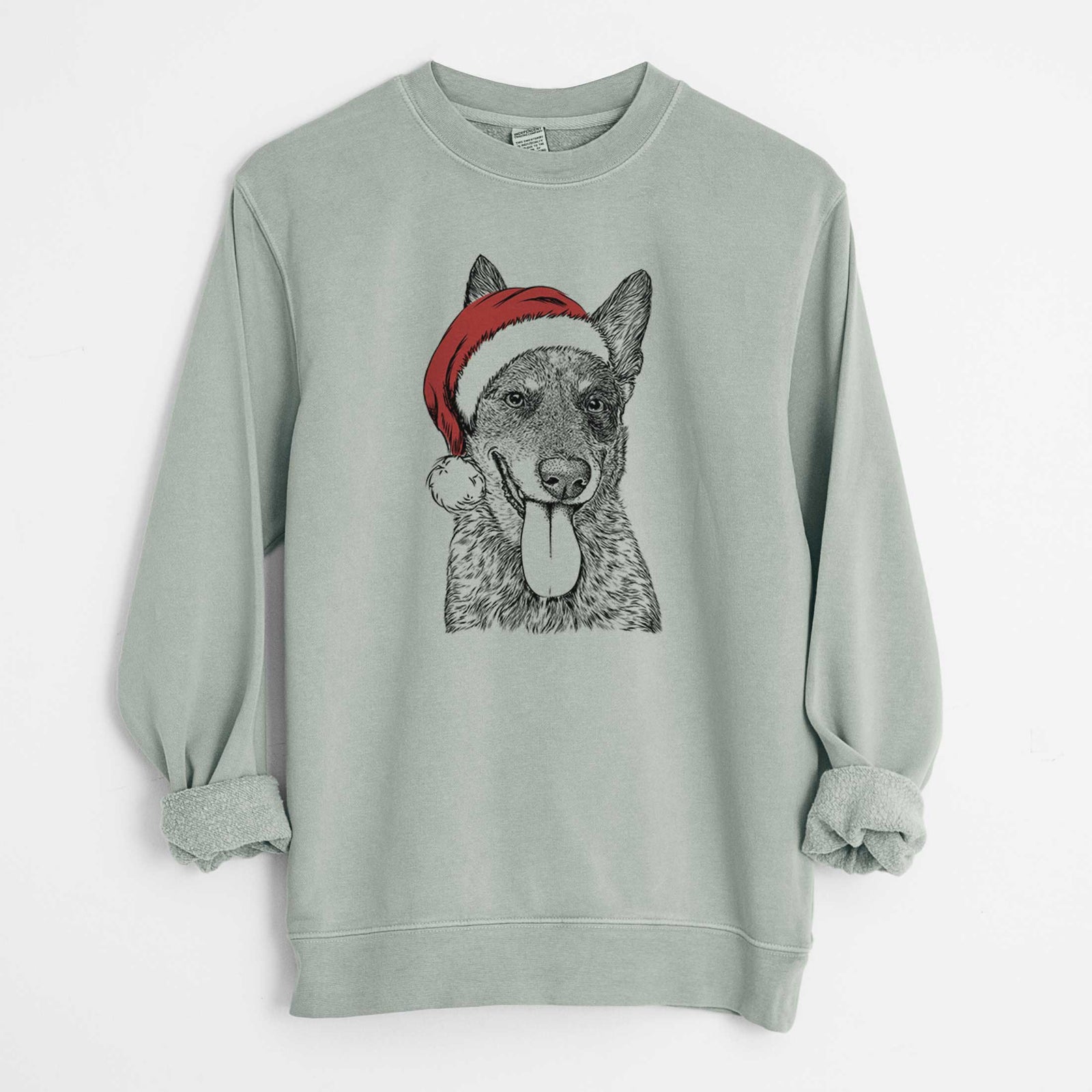 Hand-drawn sketch of Madison the Blue Heeler wearing a Santa hat on a Sage Unisex pigment dyed crew sweatshirt