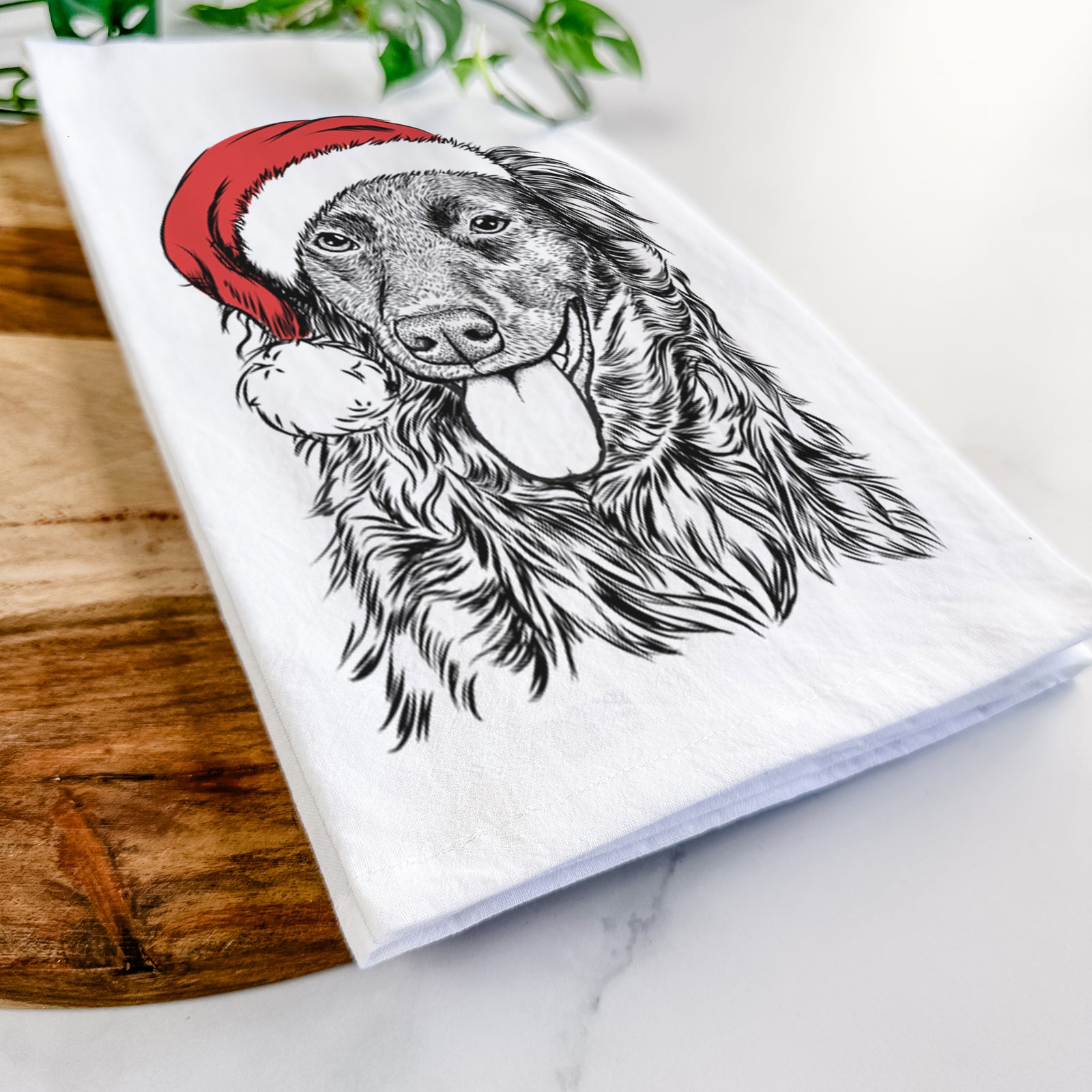Hand-drawn sketch of Maisie Mae the Aussiedor wearing a Santa hat on a tea towel