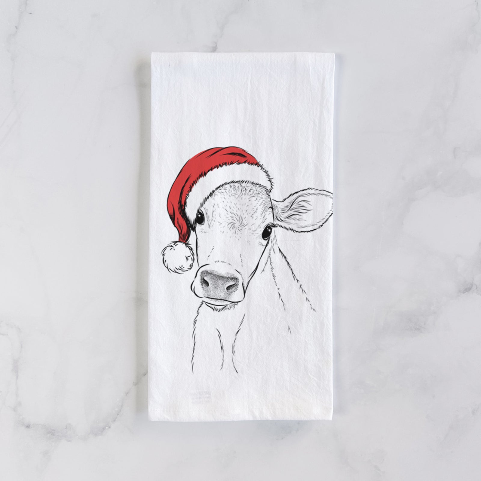 Hand-drawn sketch of Malu the Cow wearing a Santa hat on a tea towel