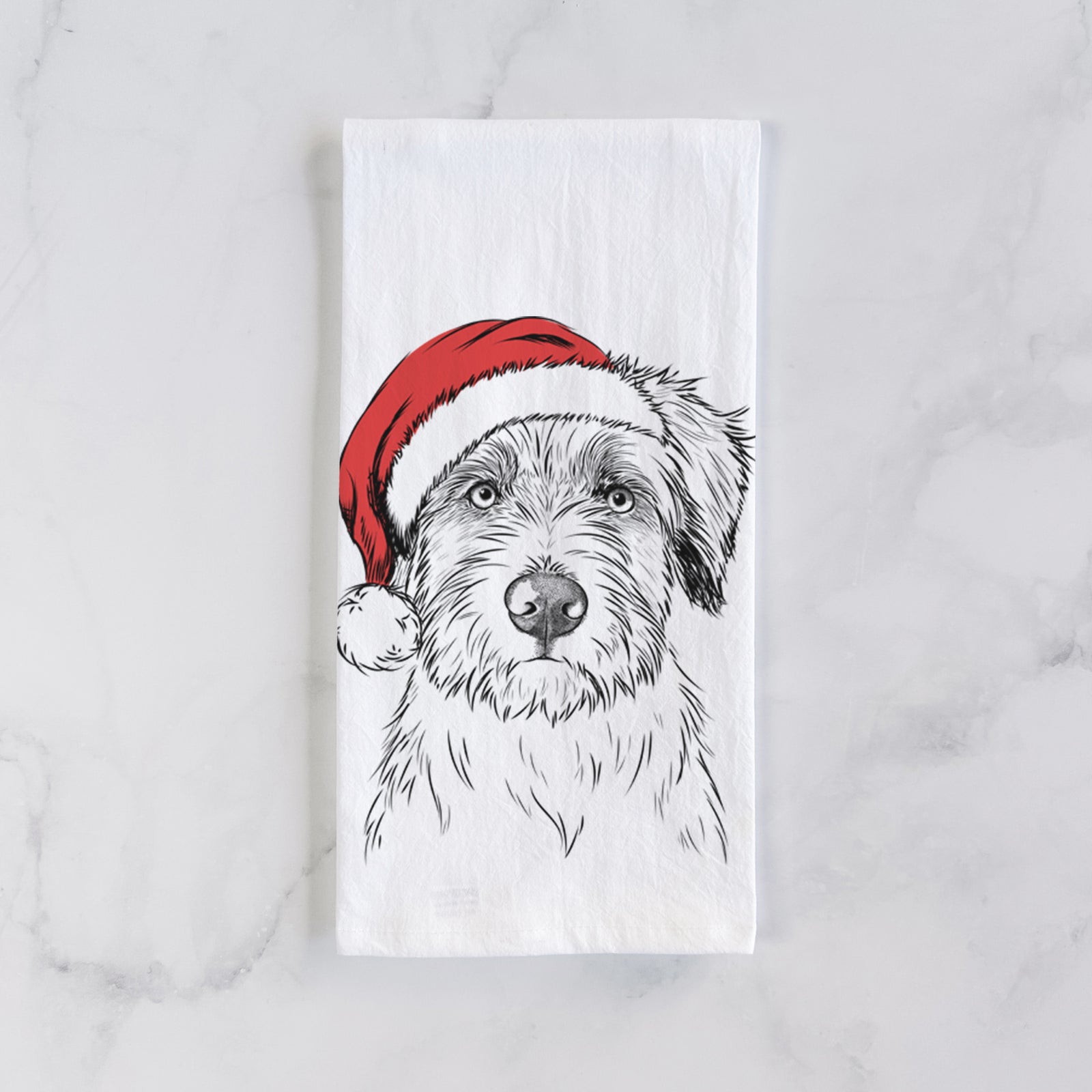 Hand-drawn sketch of Marek the Bernedoodle wearing a Santa hat on a tea towel