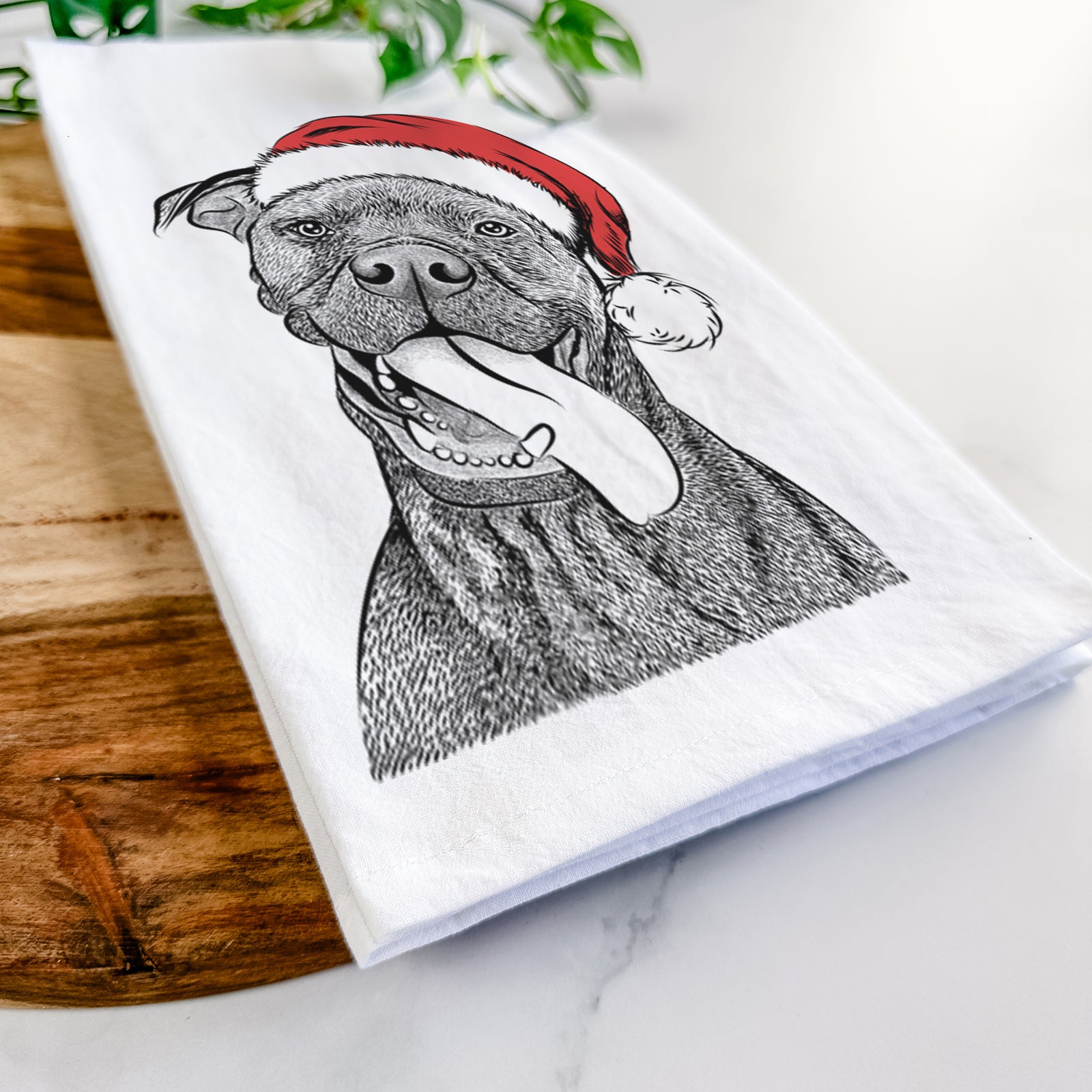 Hand-drawn sketch of Mikey the Boxador wearing a Santa hat on a tea towel