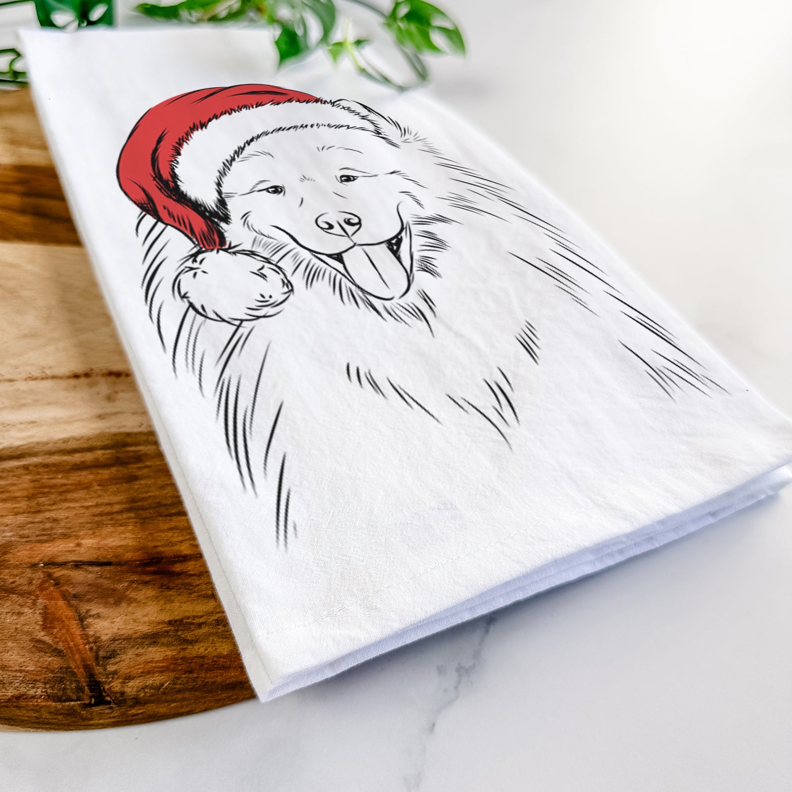 Hand-drawn sketch of Mikko the Samoyed wearing a Santa hat on a tea towel