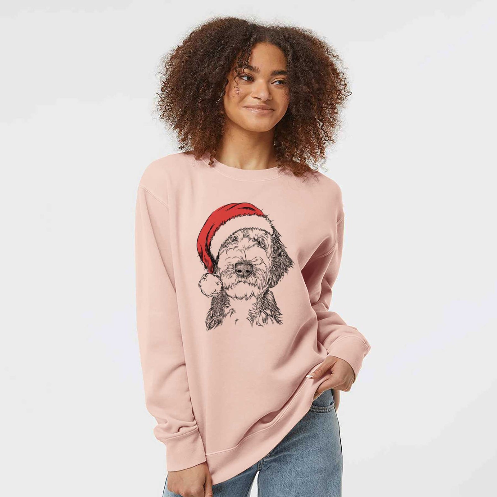 Hand-drawn sketch of Milo Fluff the Sheepadoodle wearing a Santa hat on a Dusty Pink Unisex pigment dyed crew sweatshirt