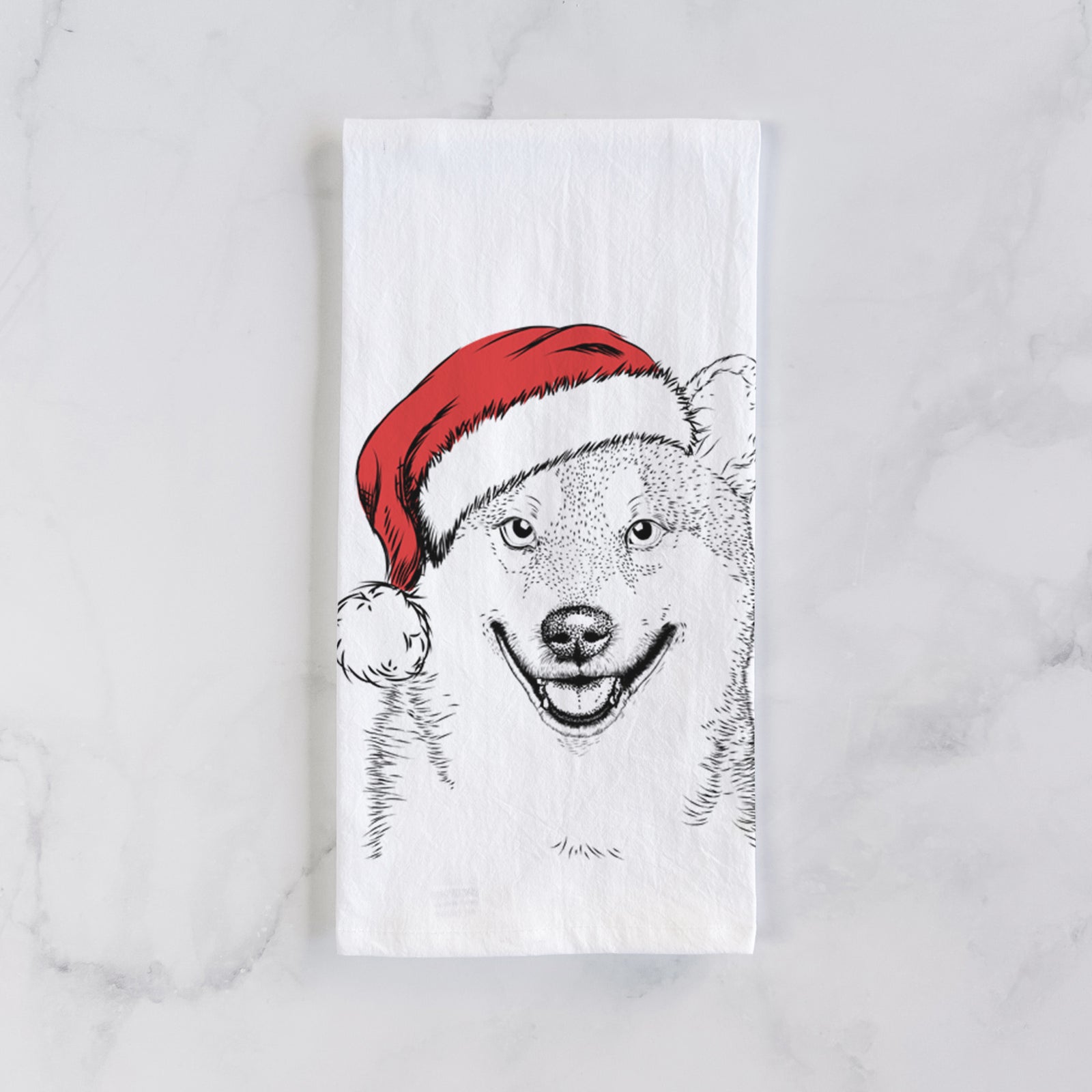 Hand-drawn sketch of Mitsu the Shiba Inu wearing a Santa hat on a tea towel