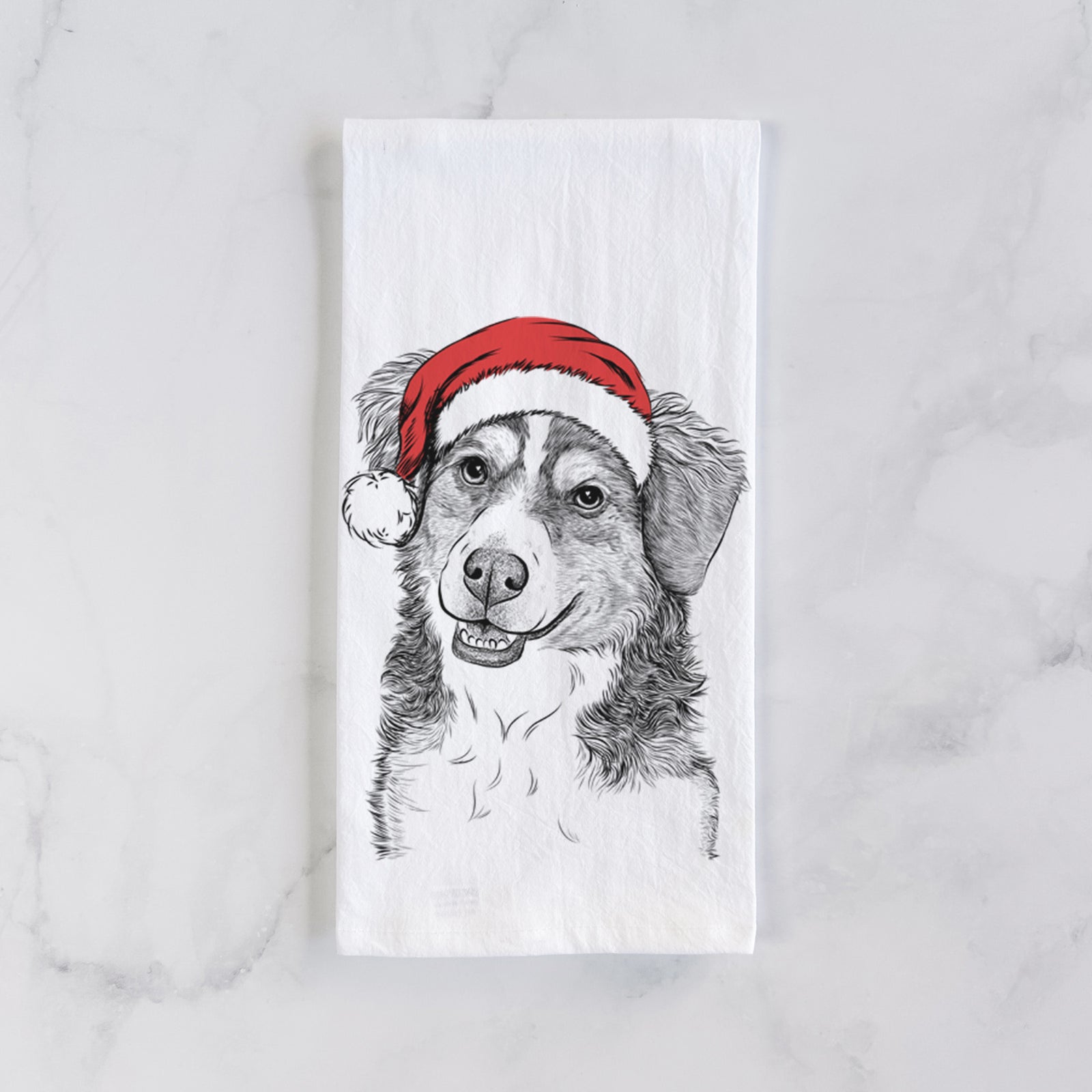 Hand-drawn sketch of Molly the Miniature Bernedoodle wearing a Santa hat on a tea towel
