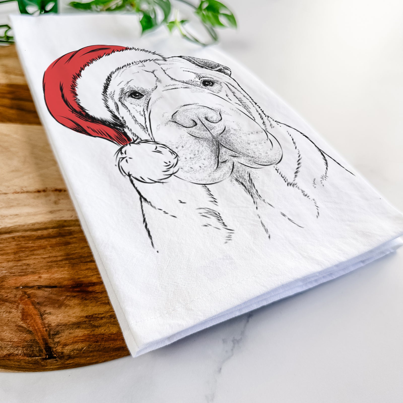 Hand-drawn sketch of Moomers the Shar Pei wearing a Santa hat on a tea towel