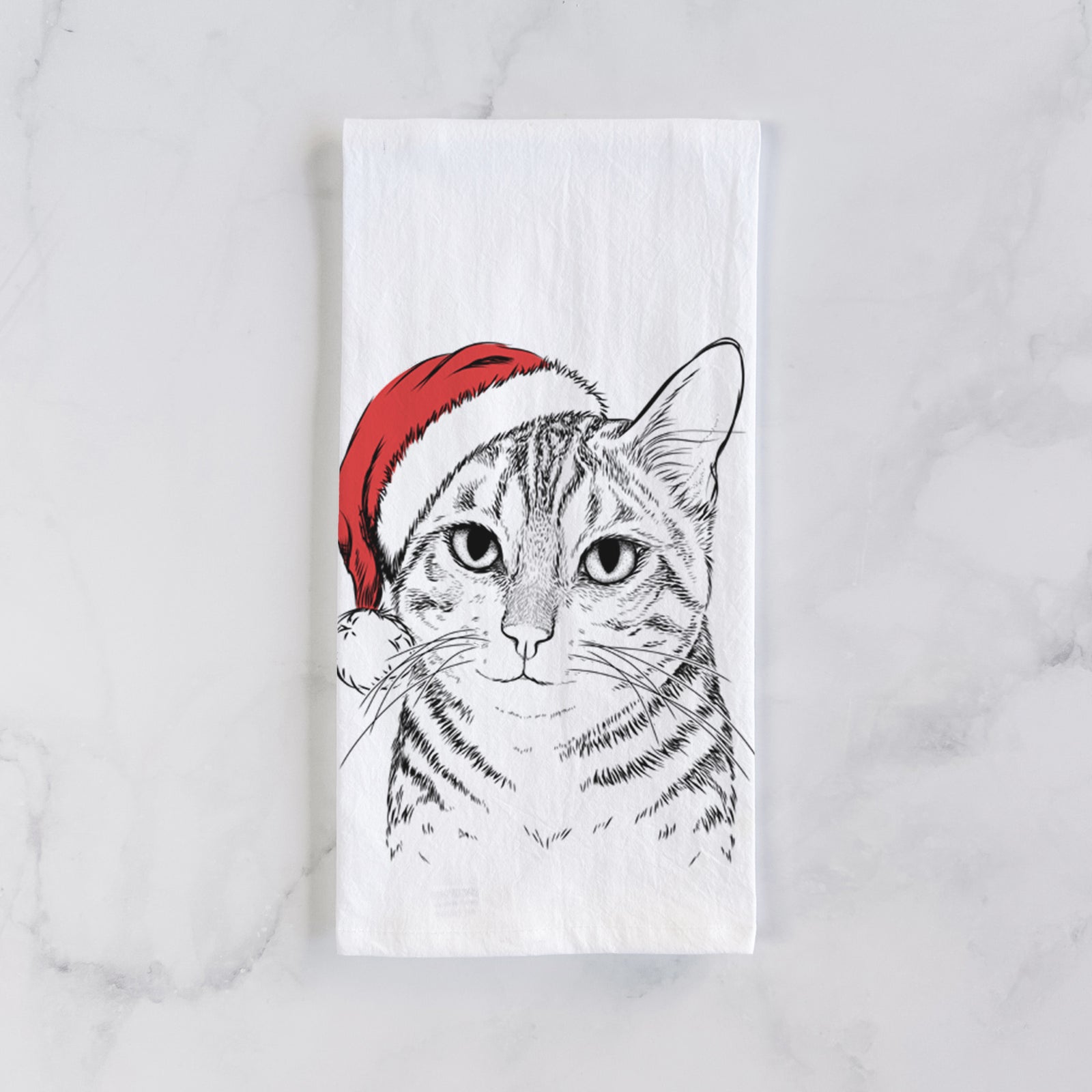 Hand-drawn sketch of Nell the Tabby Cat wearing a Santa hat on a tea towel