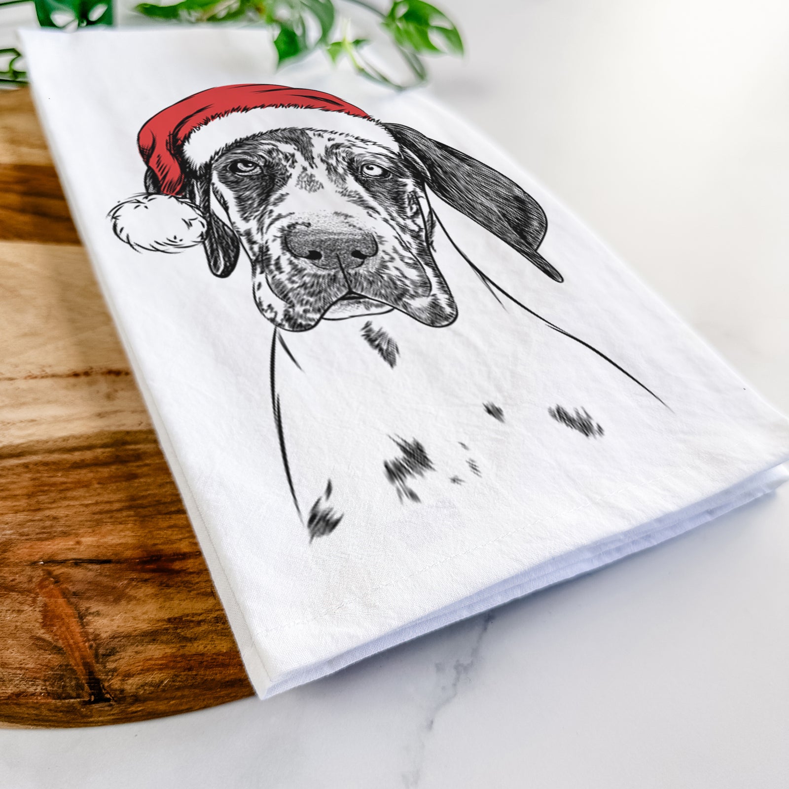 Hand-drawn sketch of Nyx the Great Dane wearing a Santa hat on a tea towel