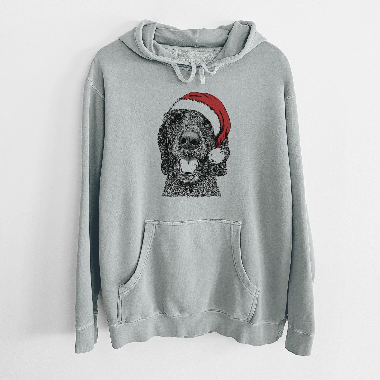 Hand-drawn sketch of Obi James the Goldendoodle wearing a Santa hat on a Sage Unisex pigment dyed hoodie