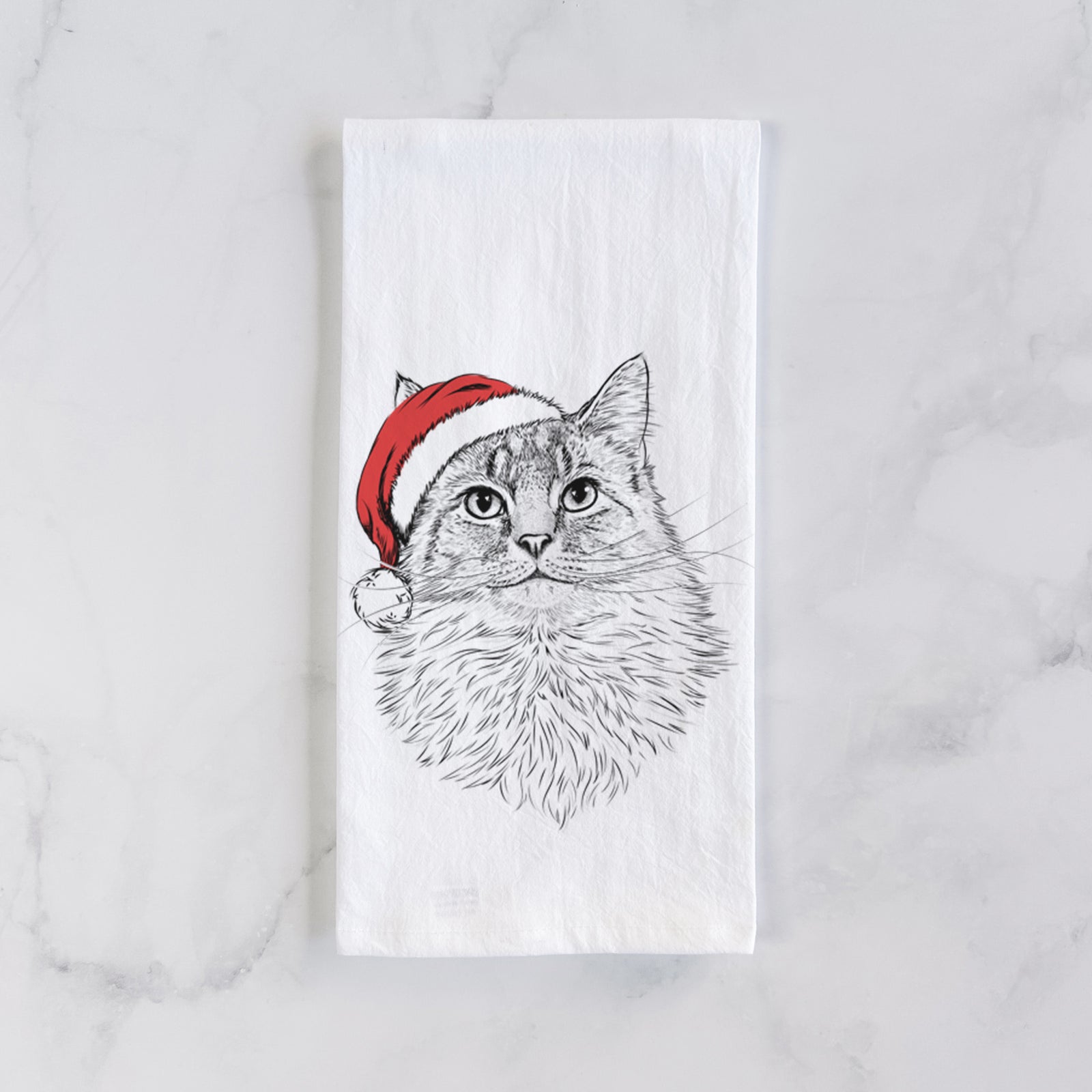 Hand-drawn sketch of Olive the Cat wearing a Santa hat on a tea towel