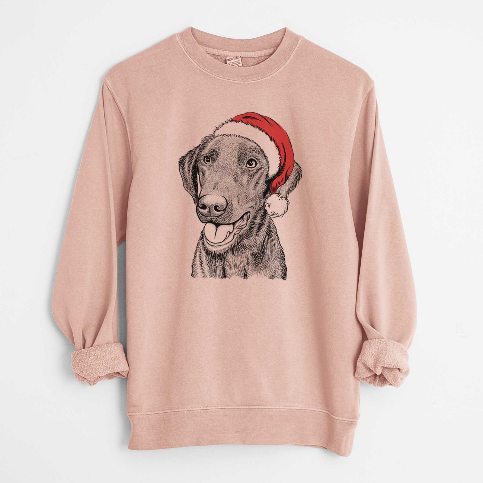 Hand-drawn sketch of Onyx the Labrador Retriever wearing a Santa hat on a Dusty Pink Unisex pigment dyed crew sweatshirt