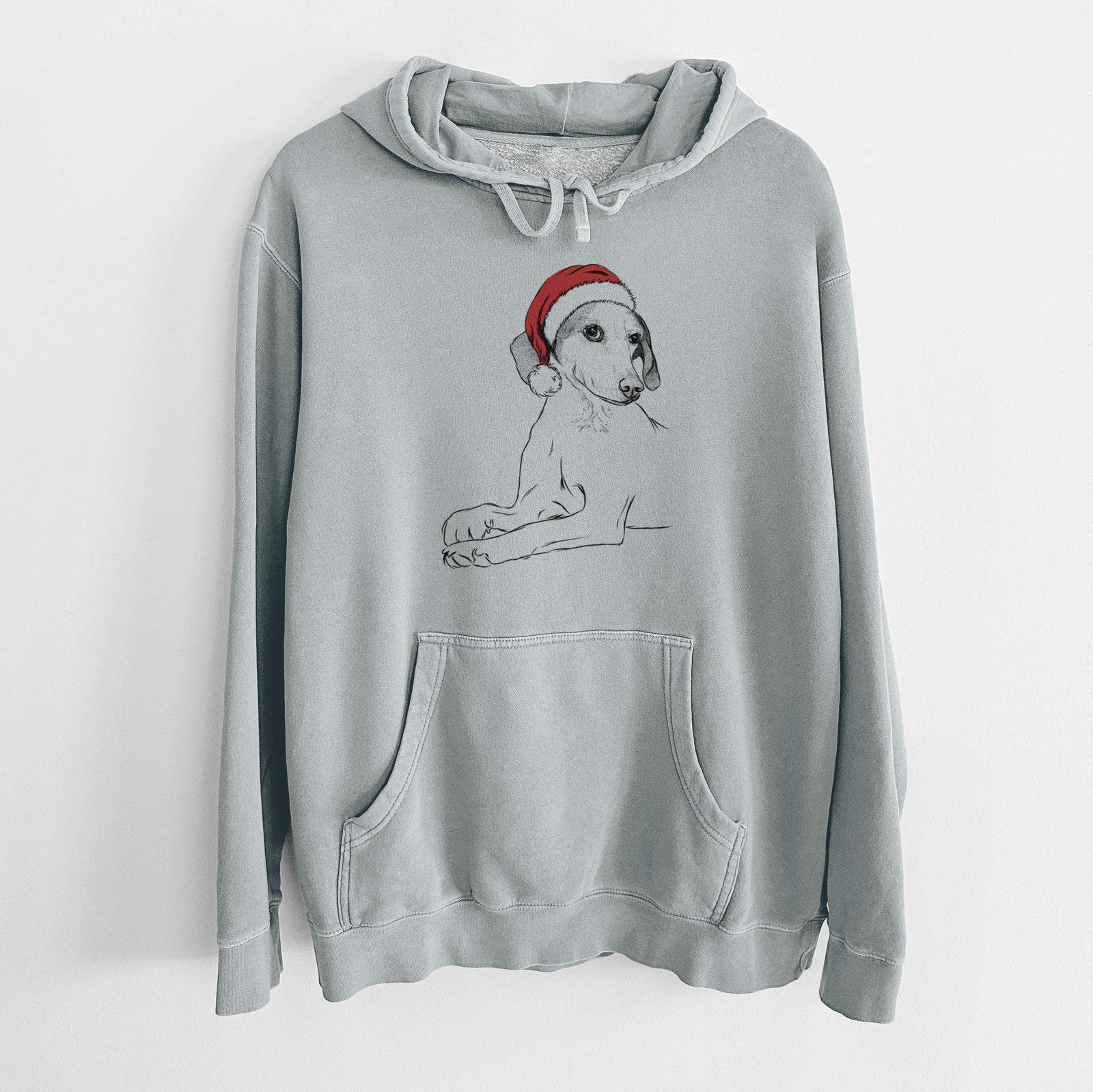 Hand-drawn sketch of Opie the Foxhound wearing a Santa hat on a Sage Unisex pigment dyed hoodie