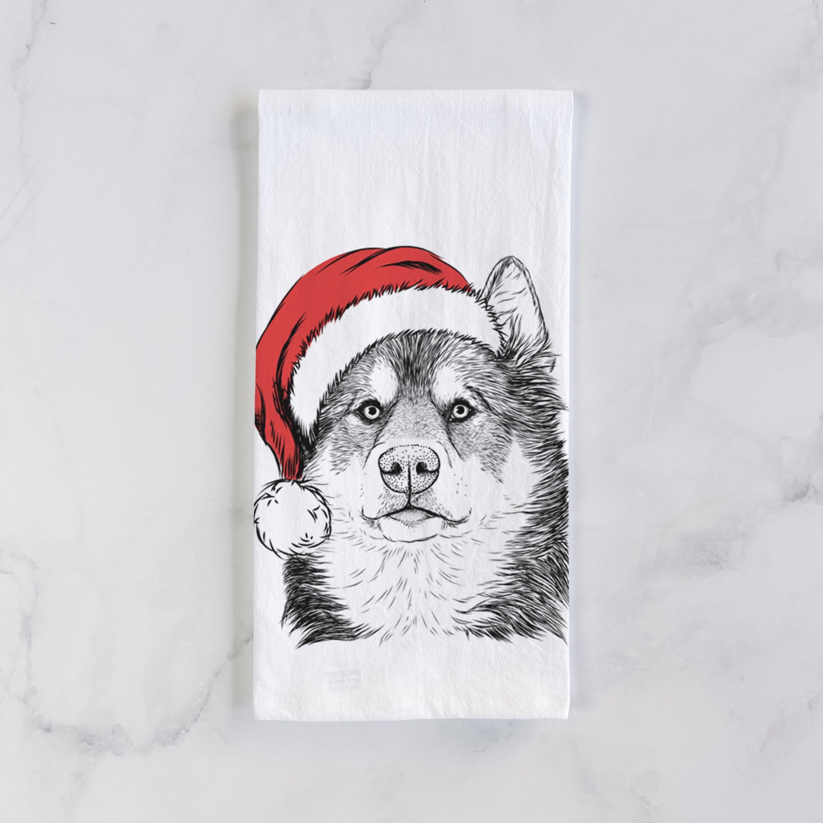 Hand-drawn sketch of Oskar the Canadian Eskimo Dog wearing a Santa hat on a tea towel