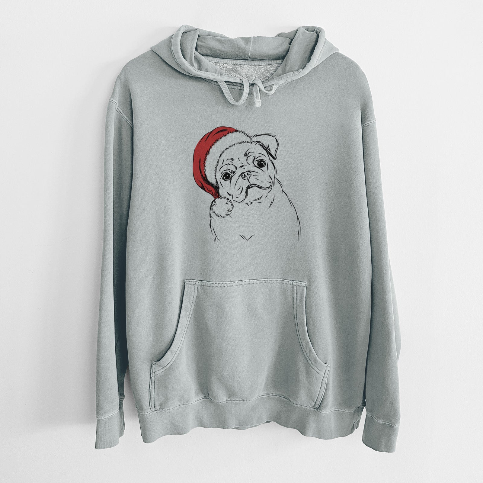 Hand-drawn sketch of Otis the Pug wearing a Santa hat on a Sage Unisex pigment dyed hoodie