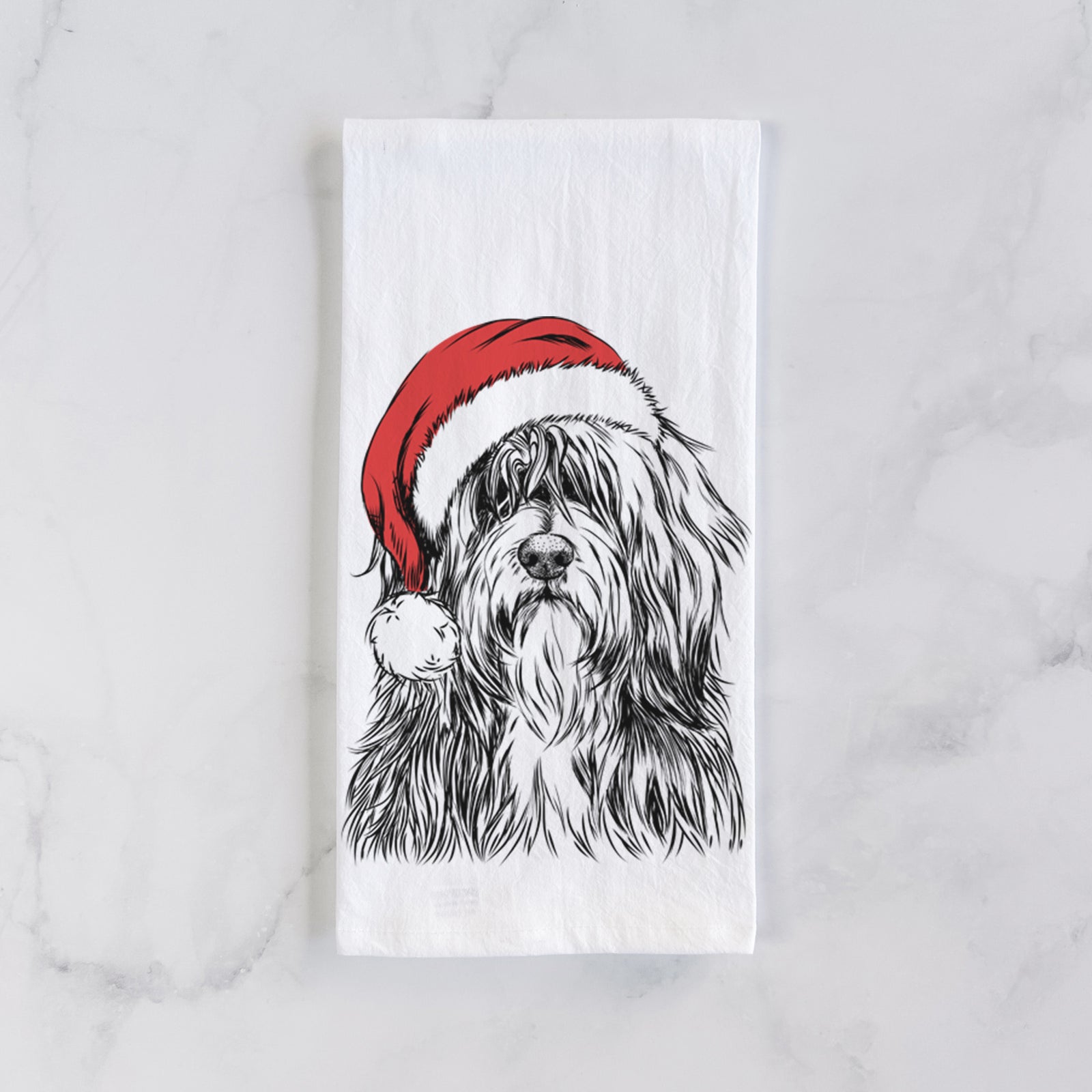 Hand-drawn sketch of Otto the Polish Lowland Sheepdog wearing a Santa hat on a tea towel