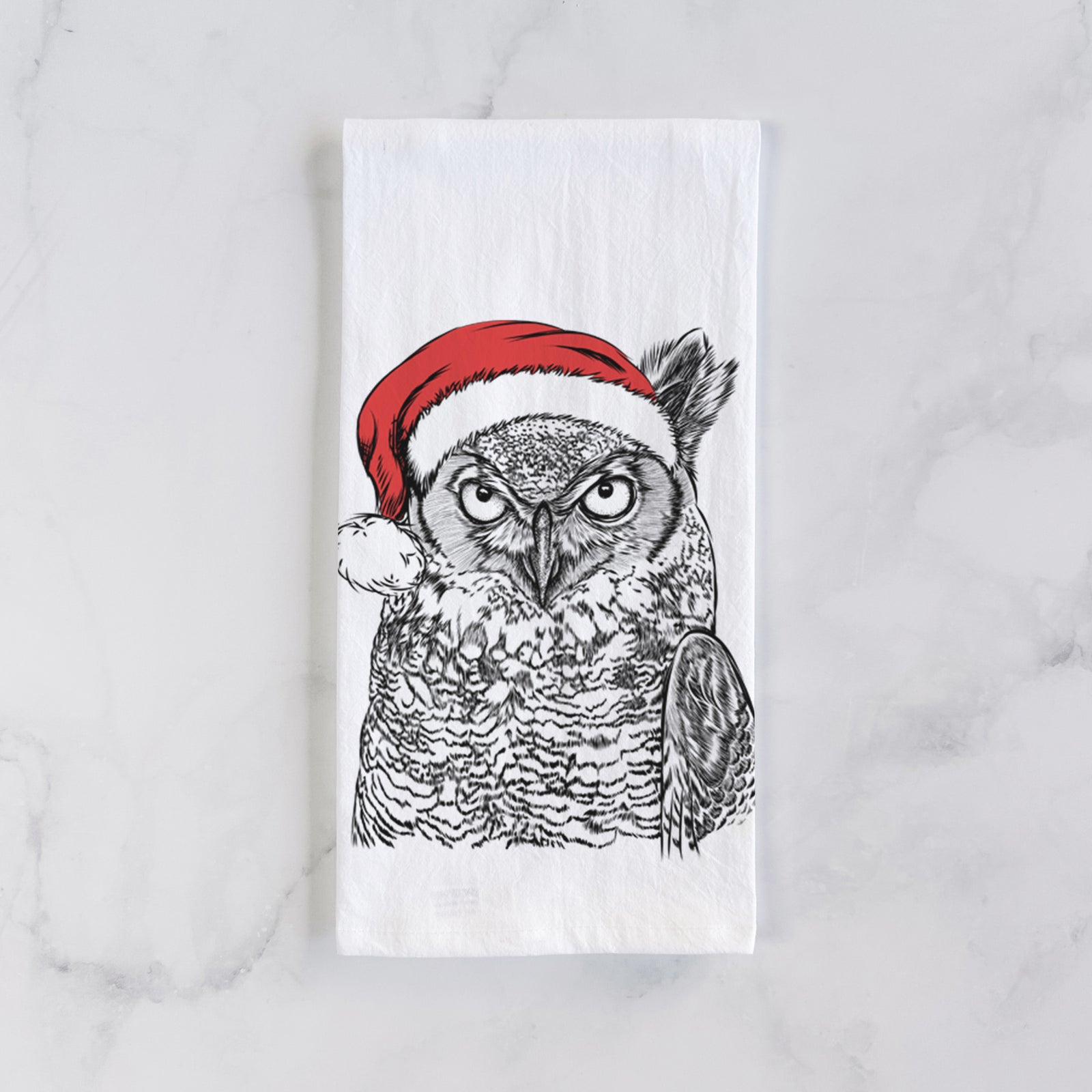 Hand-drawn sketch of Ozwald the Grey Horned Owl wearing a Santa hat on a tea towel