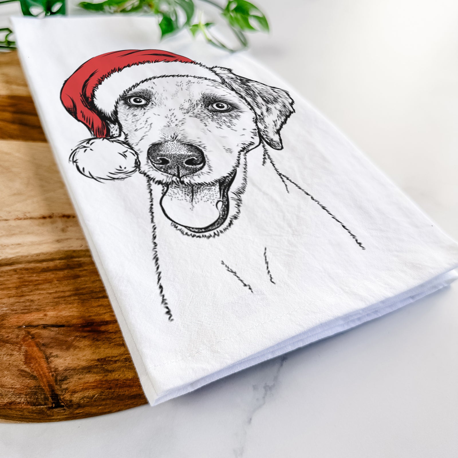 Hand-drawn sketch of Palm Palm the Aussiedoodle wearing a Santa hat on a tea towel