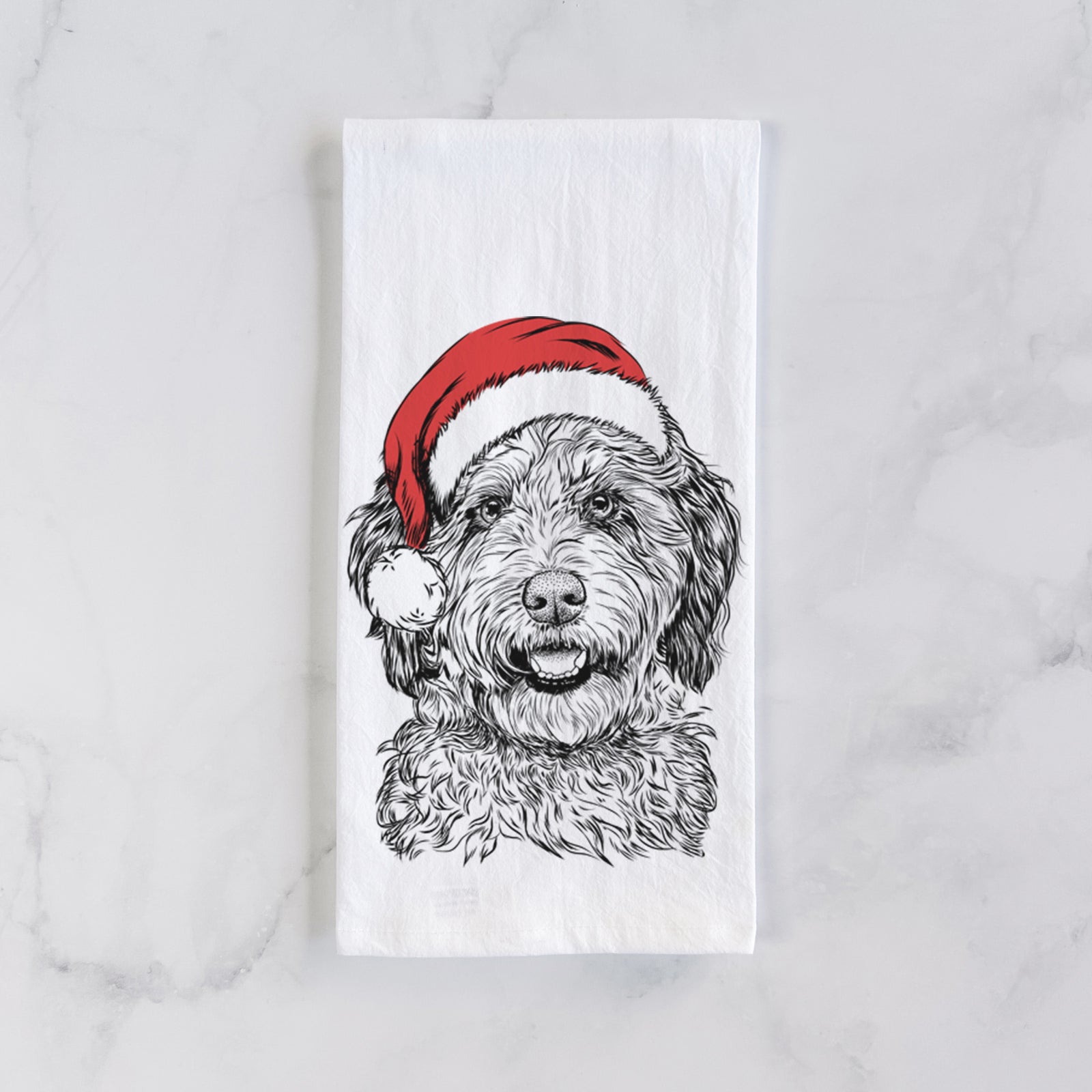 Hand-drawn sketch of Palmer the Aussiedoodle wearing a Santa hat on a tea towel