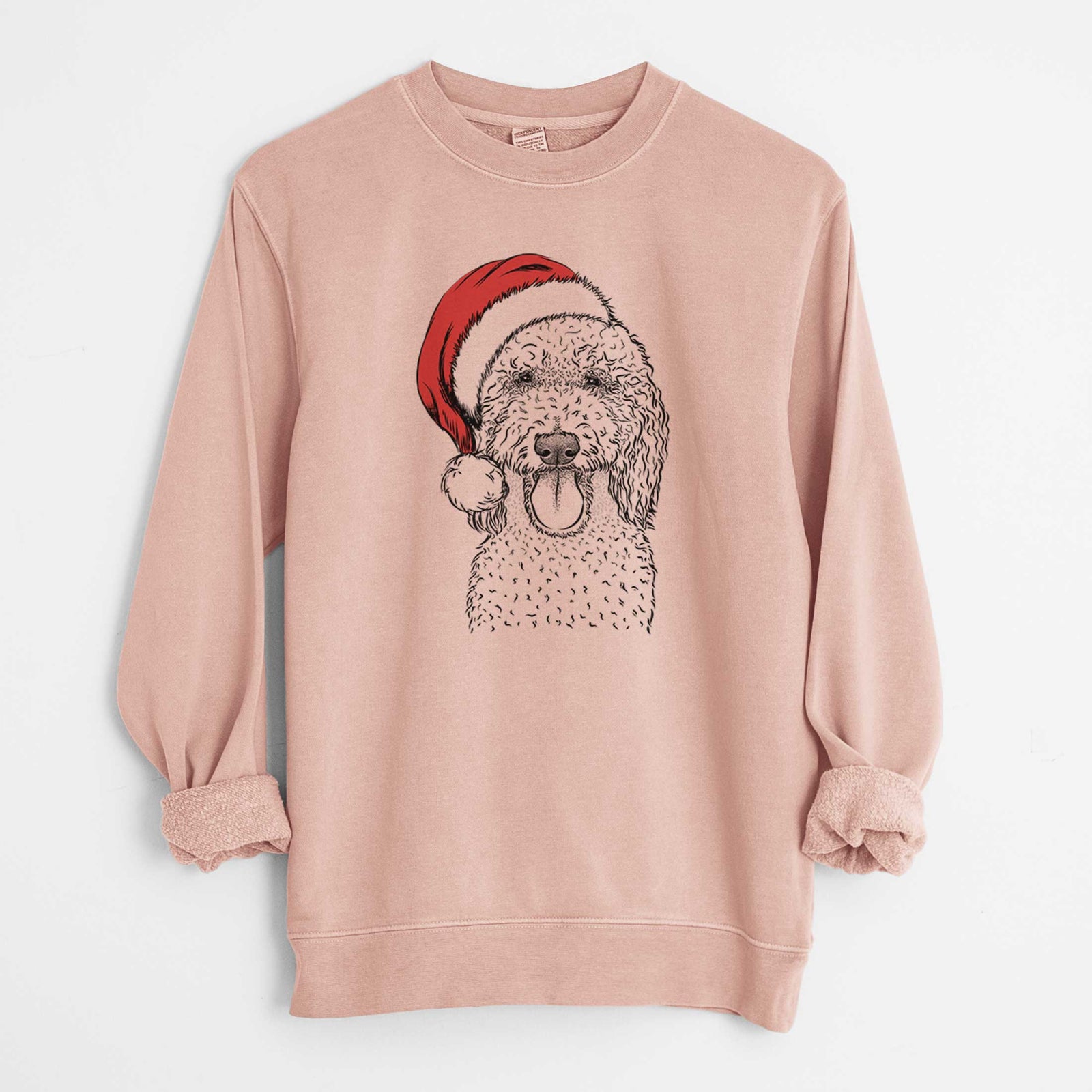 Hand-drawn sketch of Pavlov the Goldendoodle wearing a Santa hat on a Dusty Pink Unisex pigment dyed crew sweatshirt