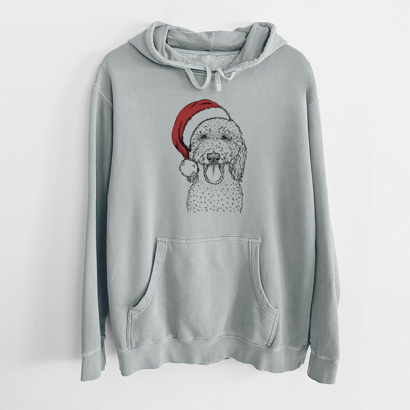Hand-drawn sketch of Pavlov the Goldendoodle wearing a Santa hat on a Sage Unisex pigment dyed hoodie
