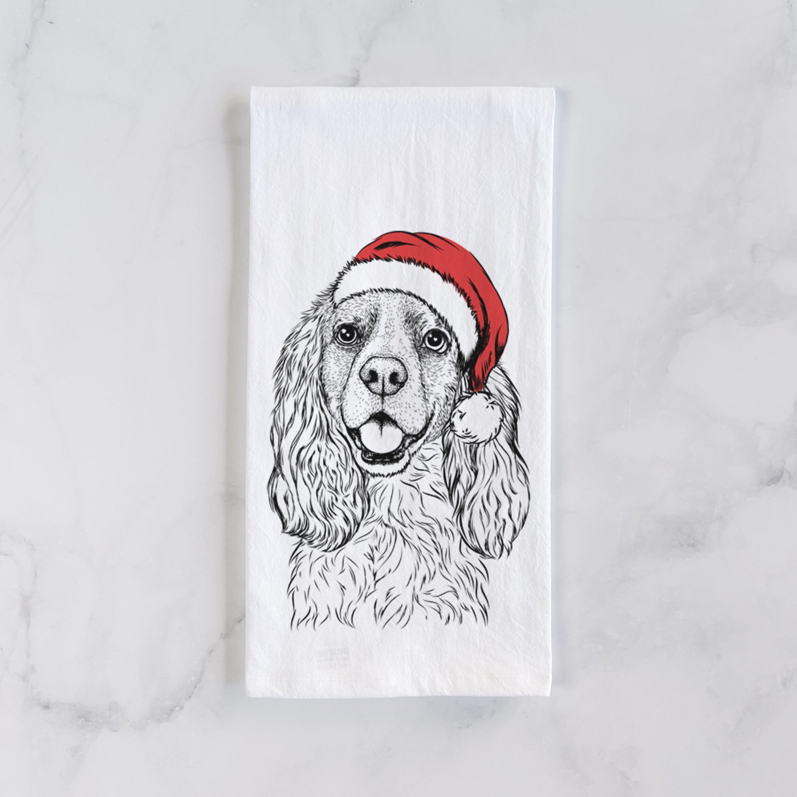 Hand-drawn sketch of Perry the Cockalier wearing a Santa hat on a tea towel