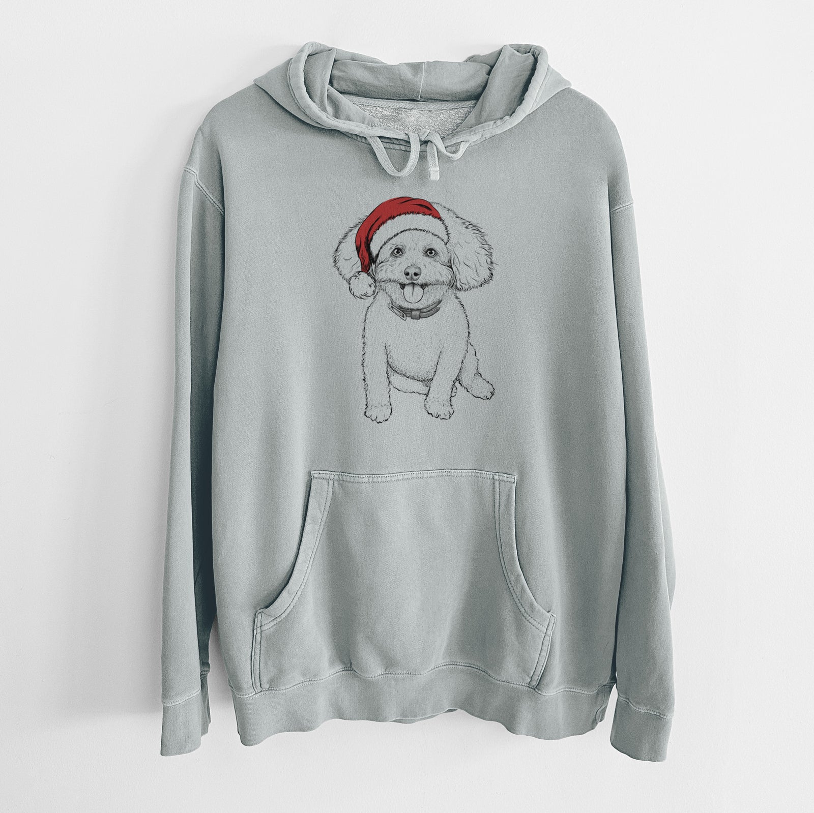 Hand-drawn sketch of Peyton the Bichon Frise wearing a Santa hat on a Sage Unisex pigment dyed hoodie