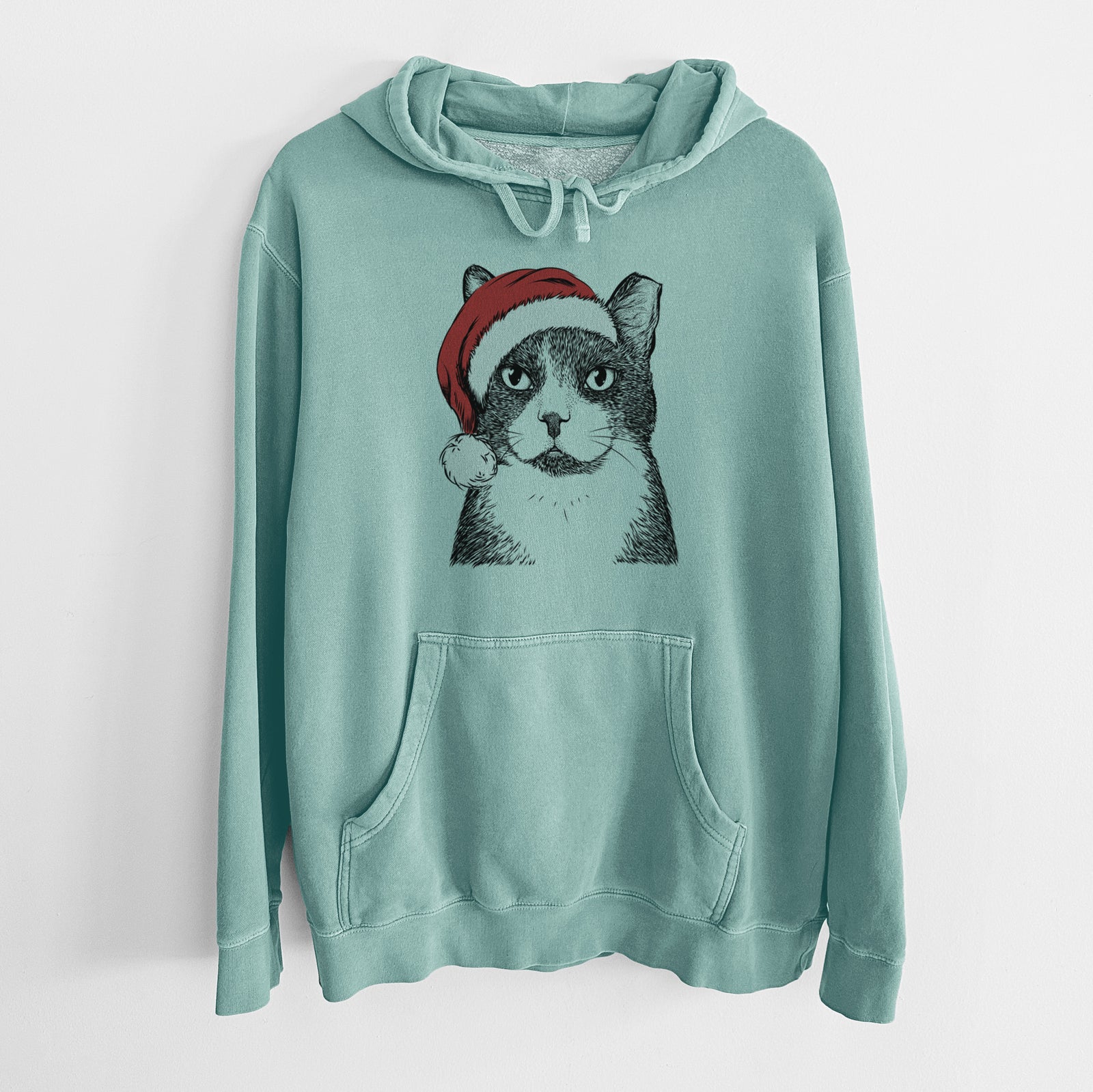Hand-drawn sketch of Pinky the Tuxedo Cat wearing a Santa hat on a Mint Unisex pigment dyed hoodie