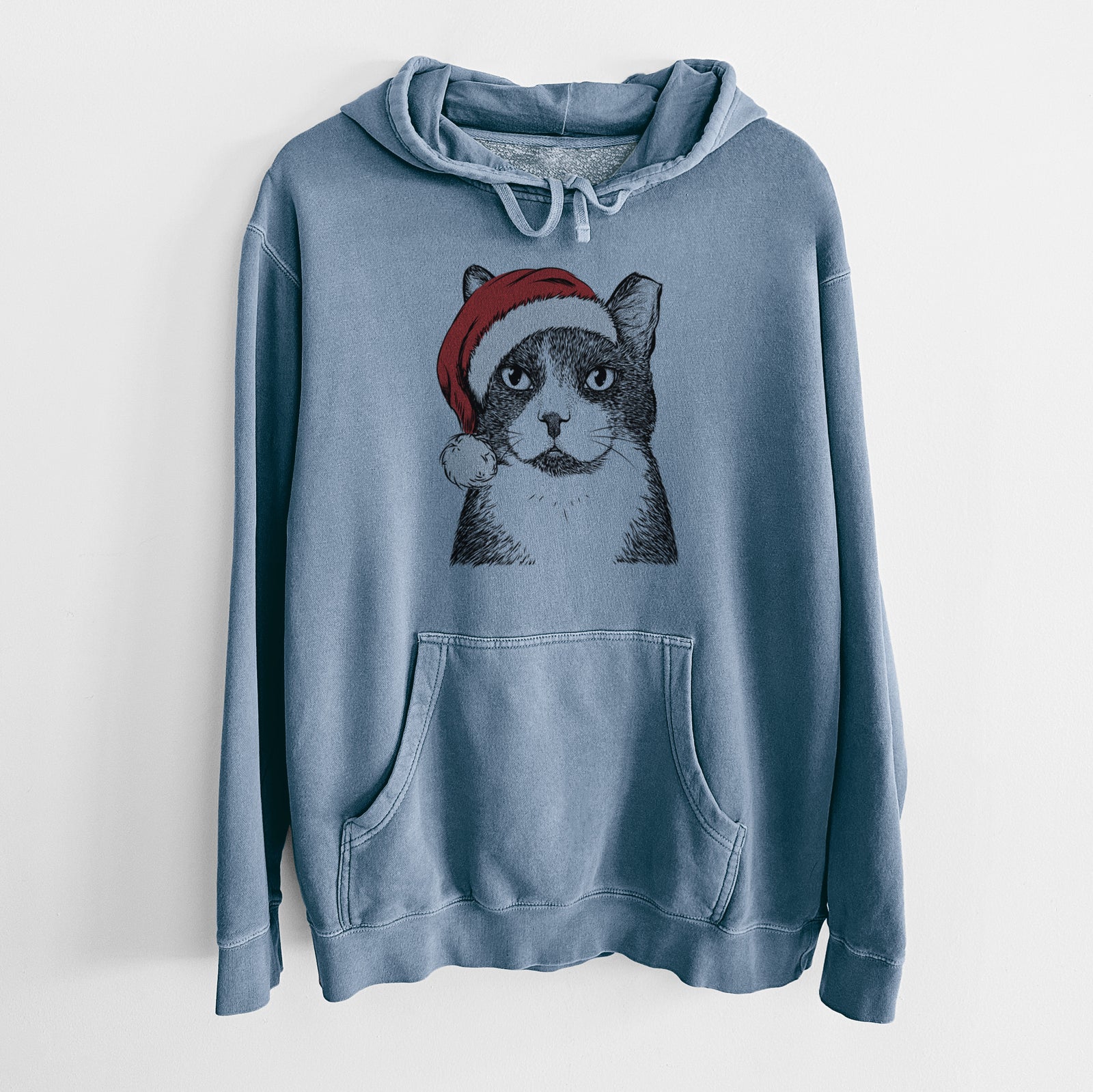 Hand-drawn sketch of Pinky the Tuxedo Cat wearing a Santa hat on a Slate Blue Unisex pigment dyed hoodie