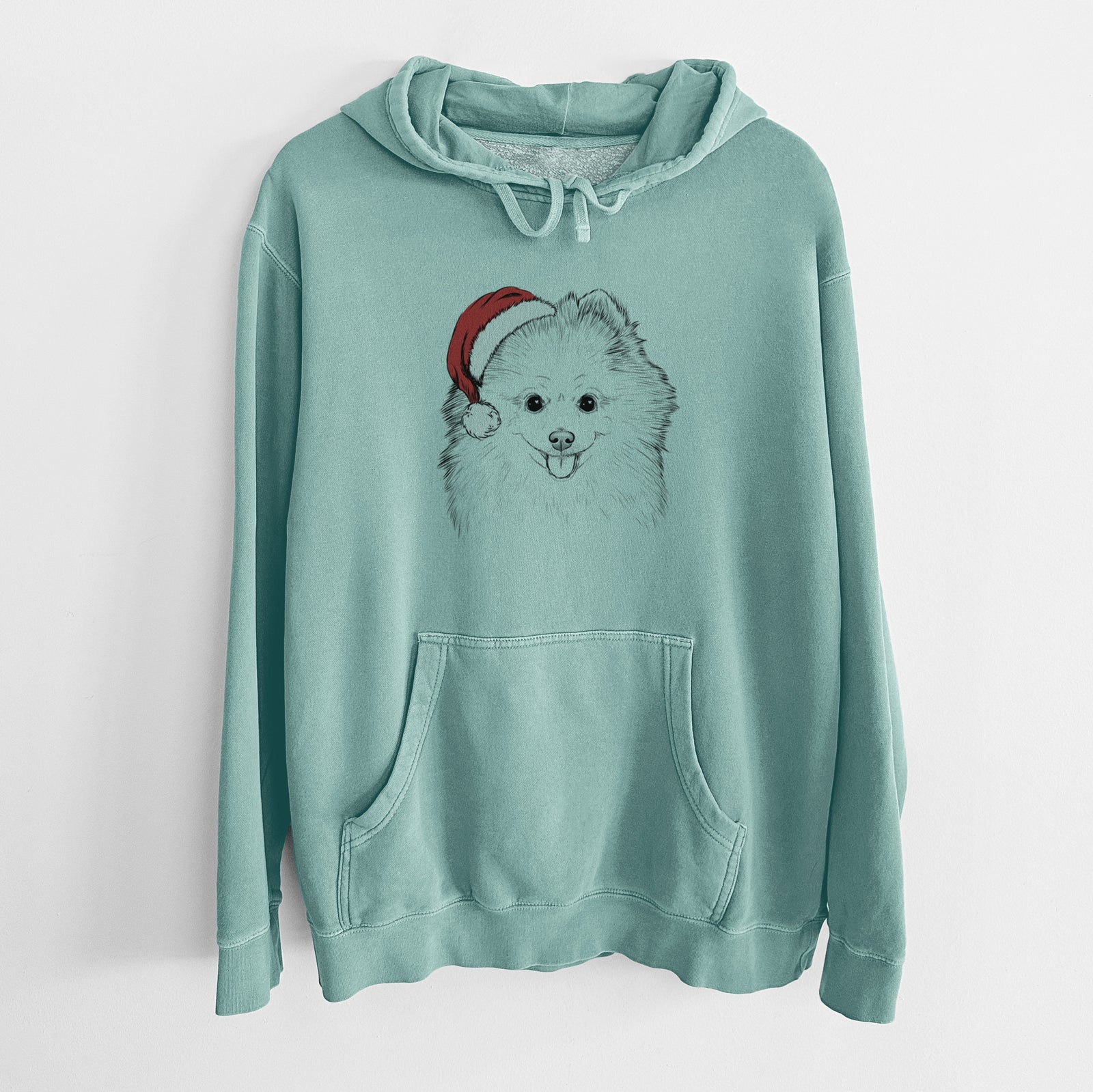 Hand-drawn sketch of Piper Jo the Pomeranian wearing a Santa hat on a Mint Unisex pigment dyed hoodie
