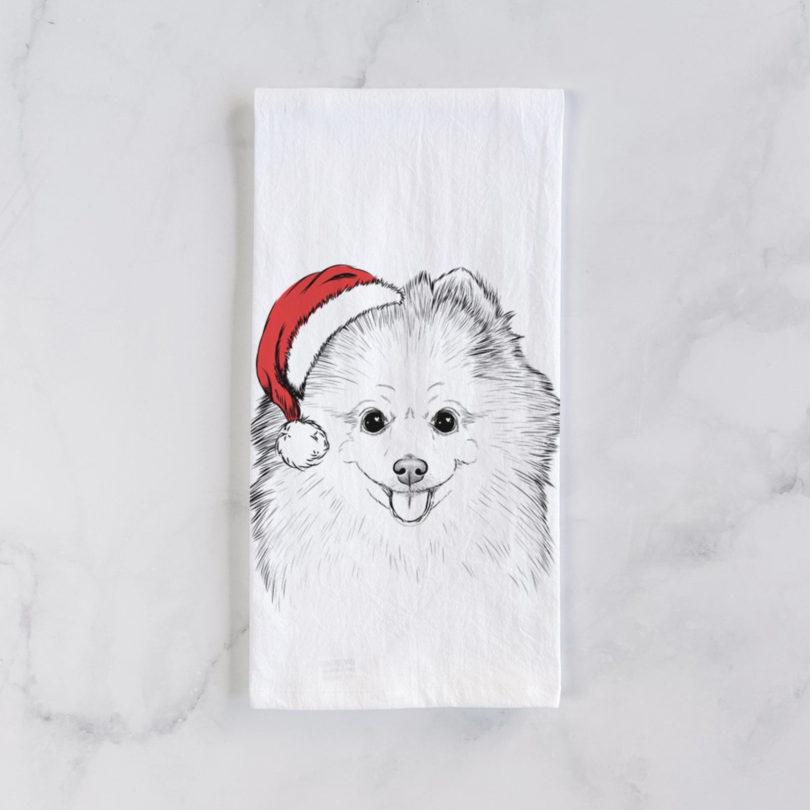 Hand-drawn sketch of Piper Jo the Pomeranian wearing a Santa hat on a tea towel