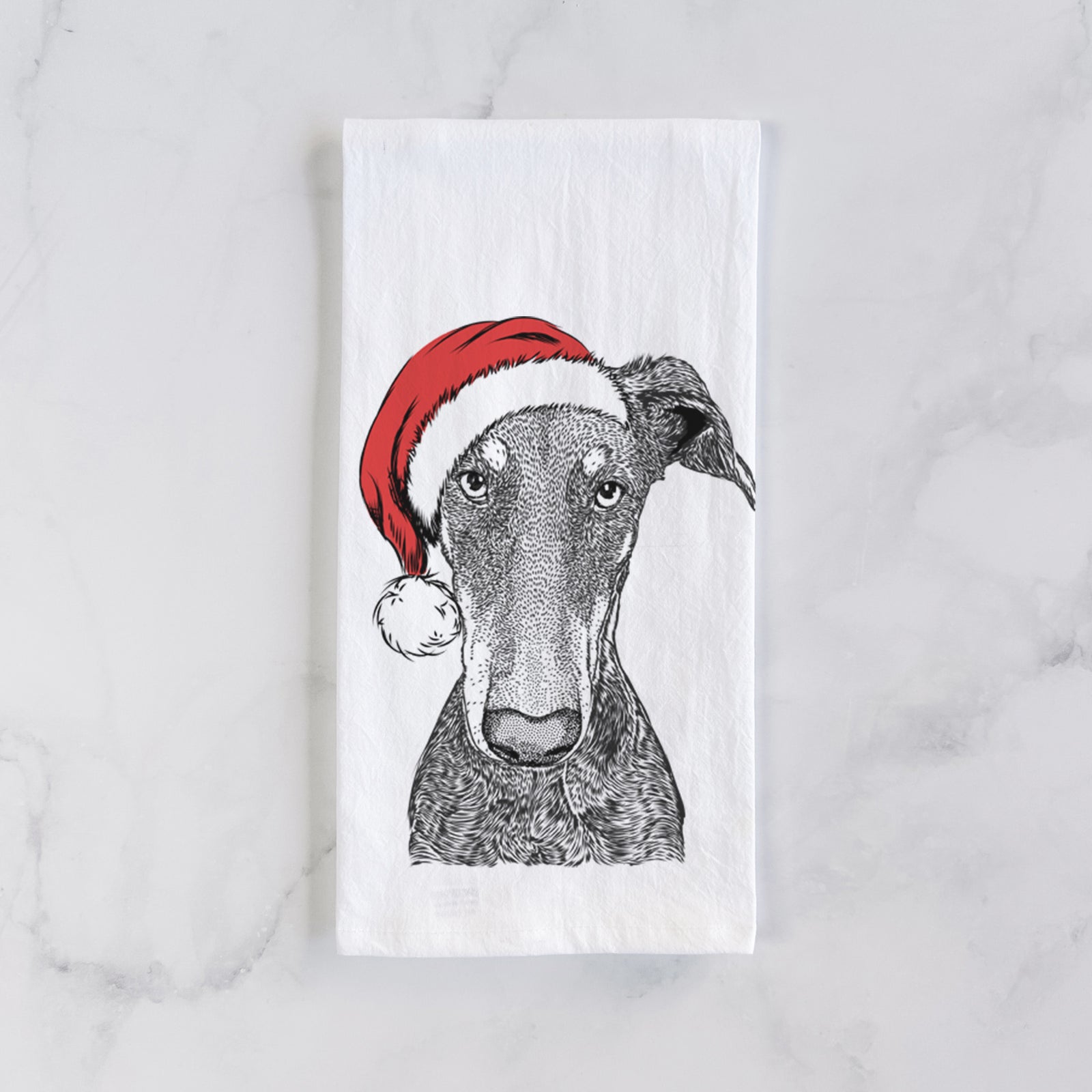Hand-drawn sketch of Princess Fiona the Doberman Pinscher wearing a Santa hat on a tea towel