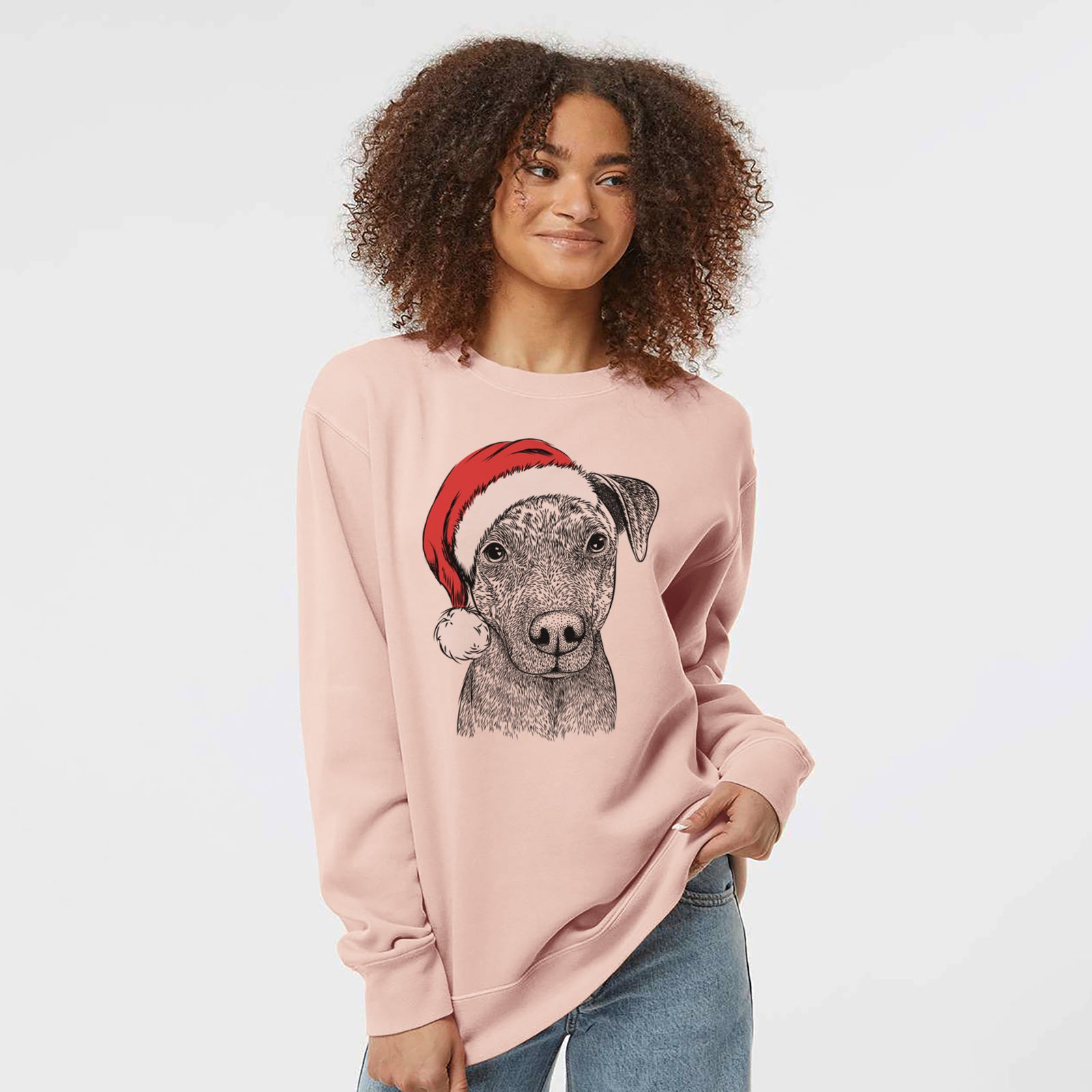 Hand-drawn sketch of Reeses the Pitbull wearing a Santa hat on a Dusty Pink Unisex pigment dyed crew sweatshirt