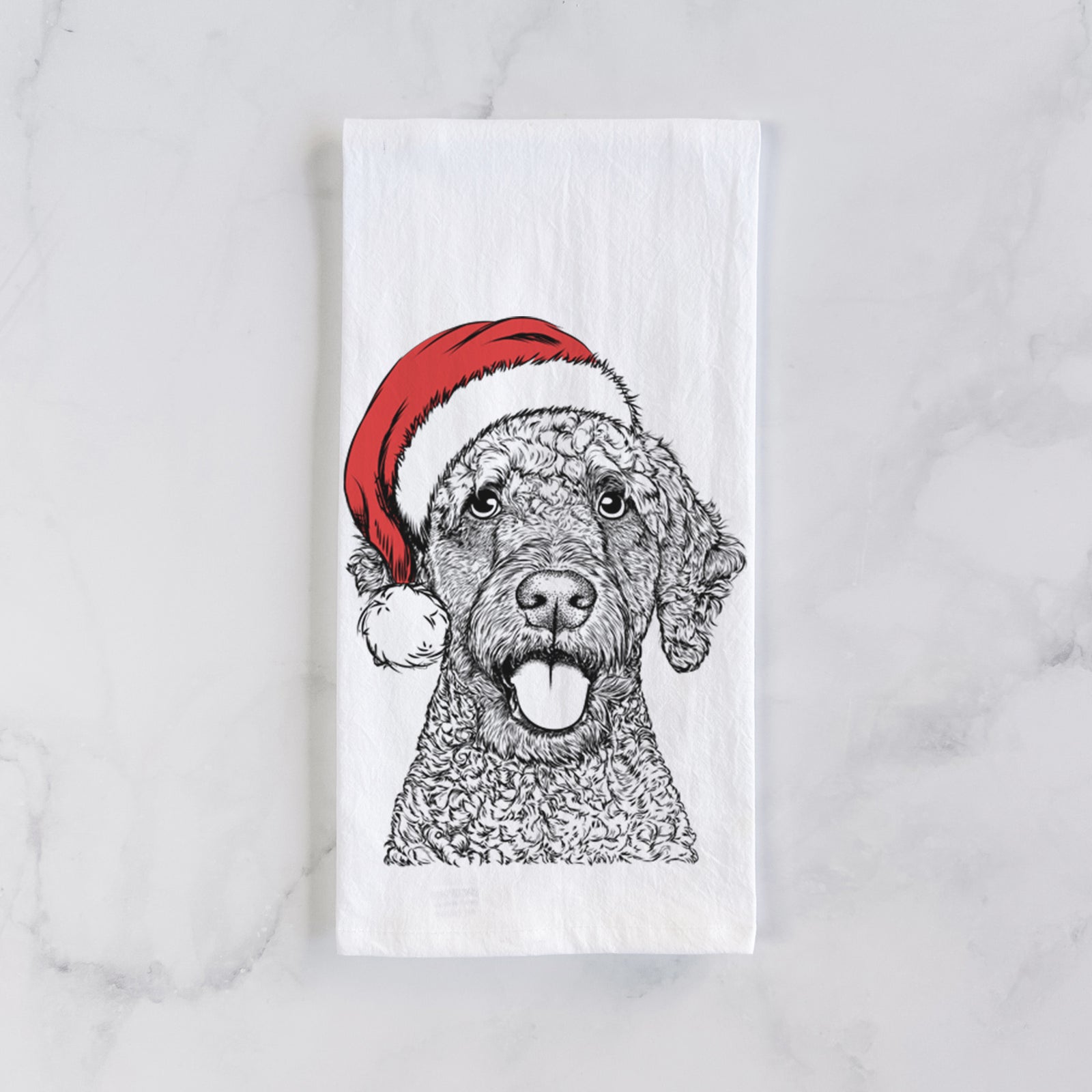 Hand-drawn sketch of Reina the Spanish Water Dog wearing a Santa hat on a tea towel