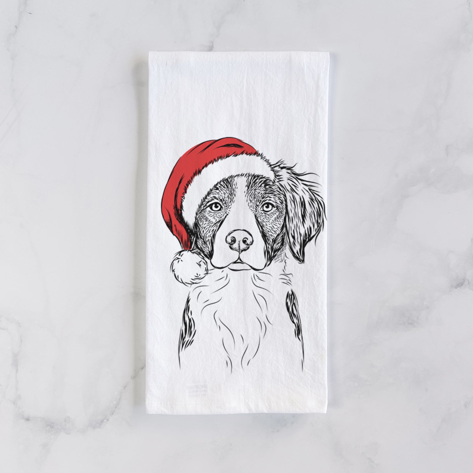 Hand-drawn sketch of Remi the Brittany wearing a Santa hat on a tea towel
