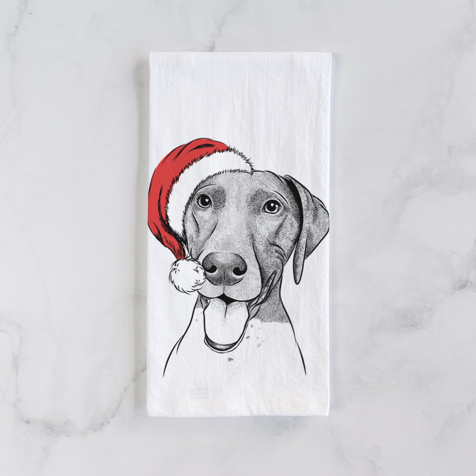 Hand-drawn sketch of Remi the German Shorthaired Pointer wearing a Santa hat on a tea towel