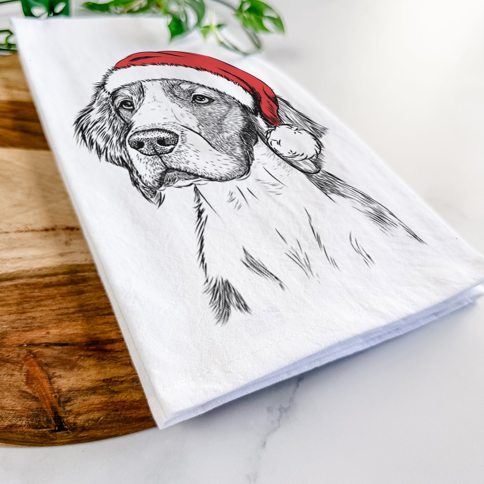 Hand-drawn sketch of Roxy the Welsh Springer Spaniel wearing a Santa hat on a tea towel