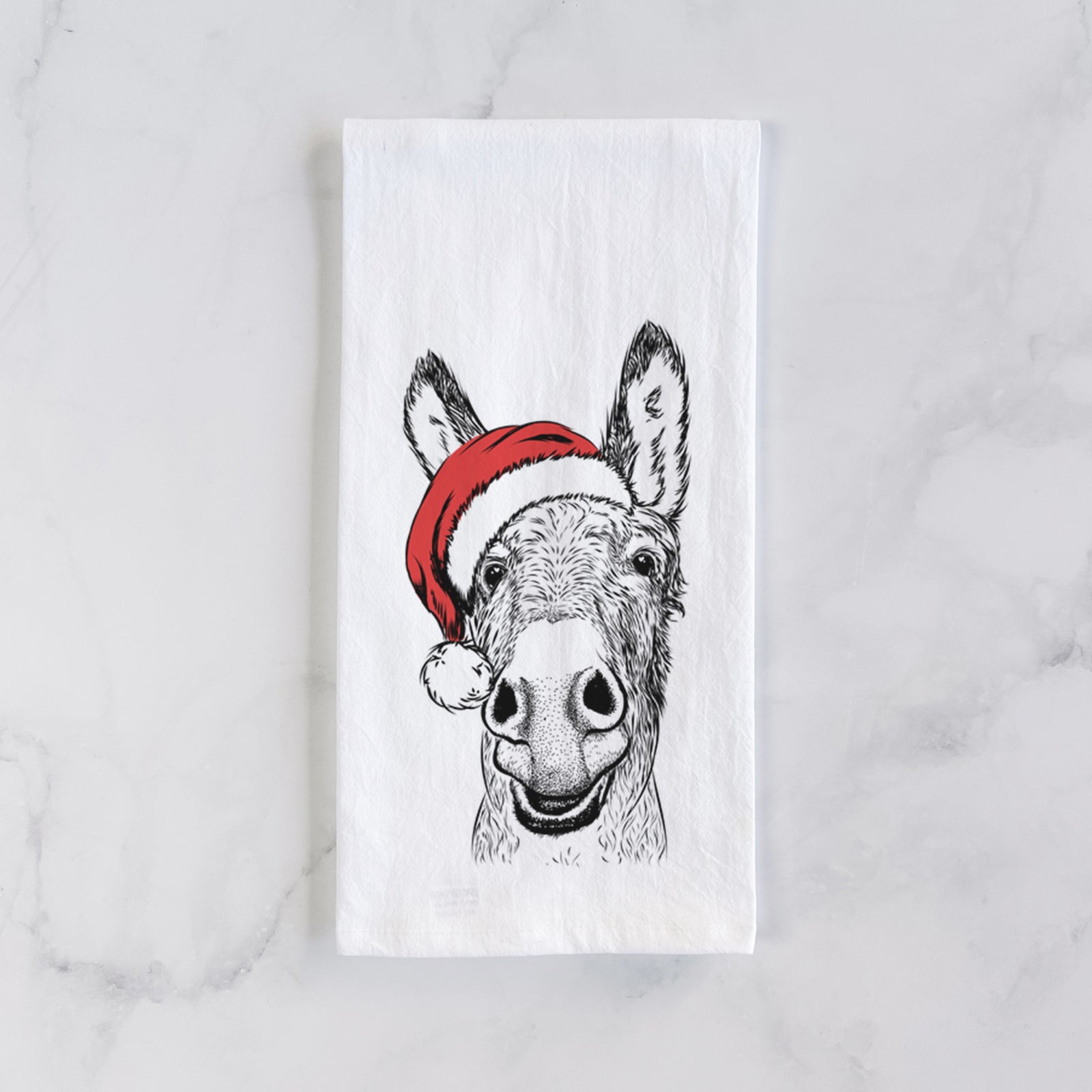Hand-drawn sketch of Samule the Donkey wearing a Santa hat on a tea towel