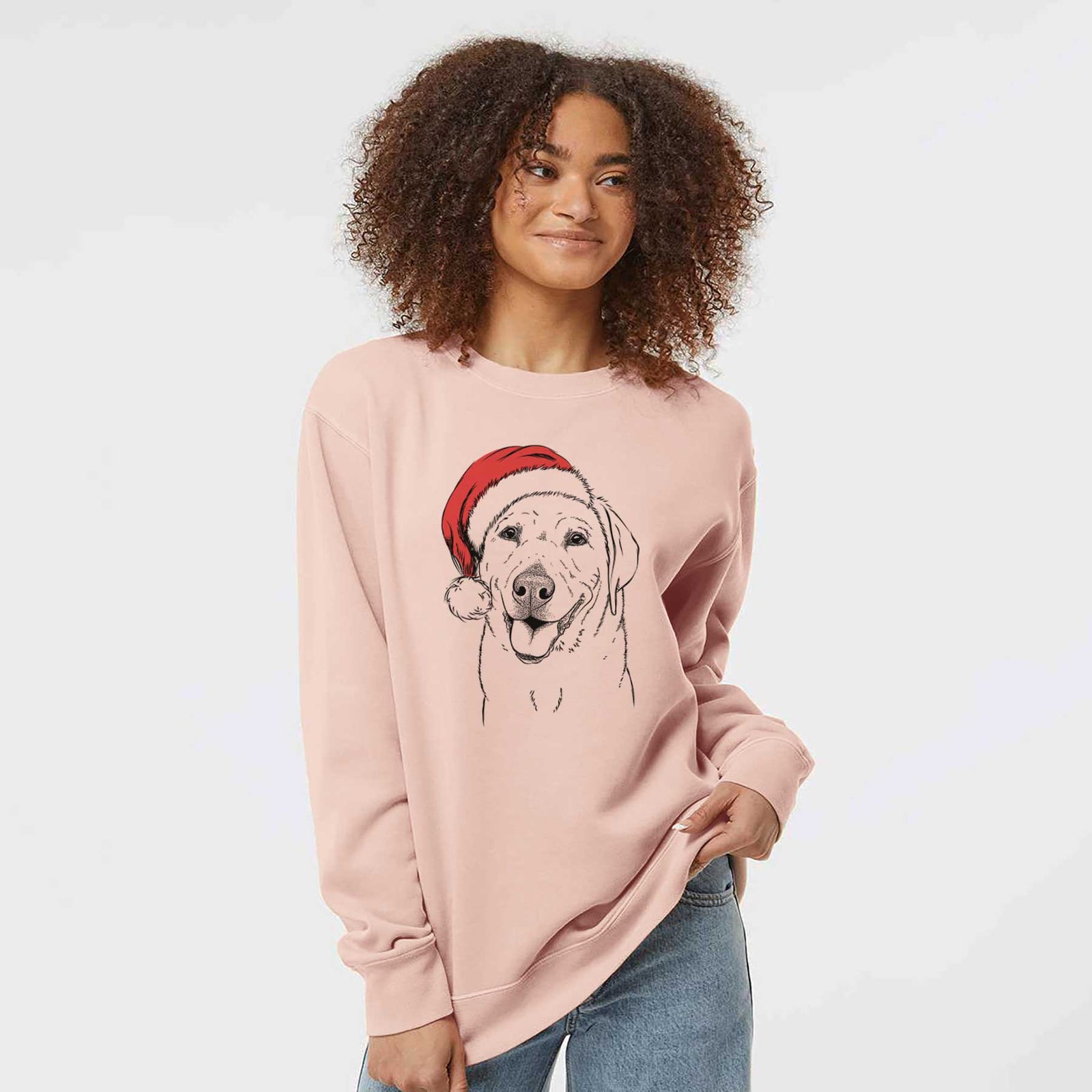 Hand-drawn sketch of Sanford the Labrador Retriever wearing a Santa hat on a Dusty Pink Unisex pigment dyed crew sweatshirt