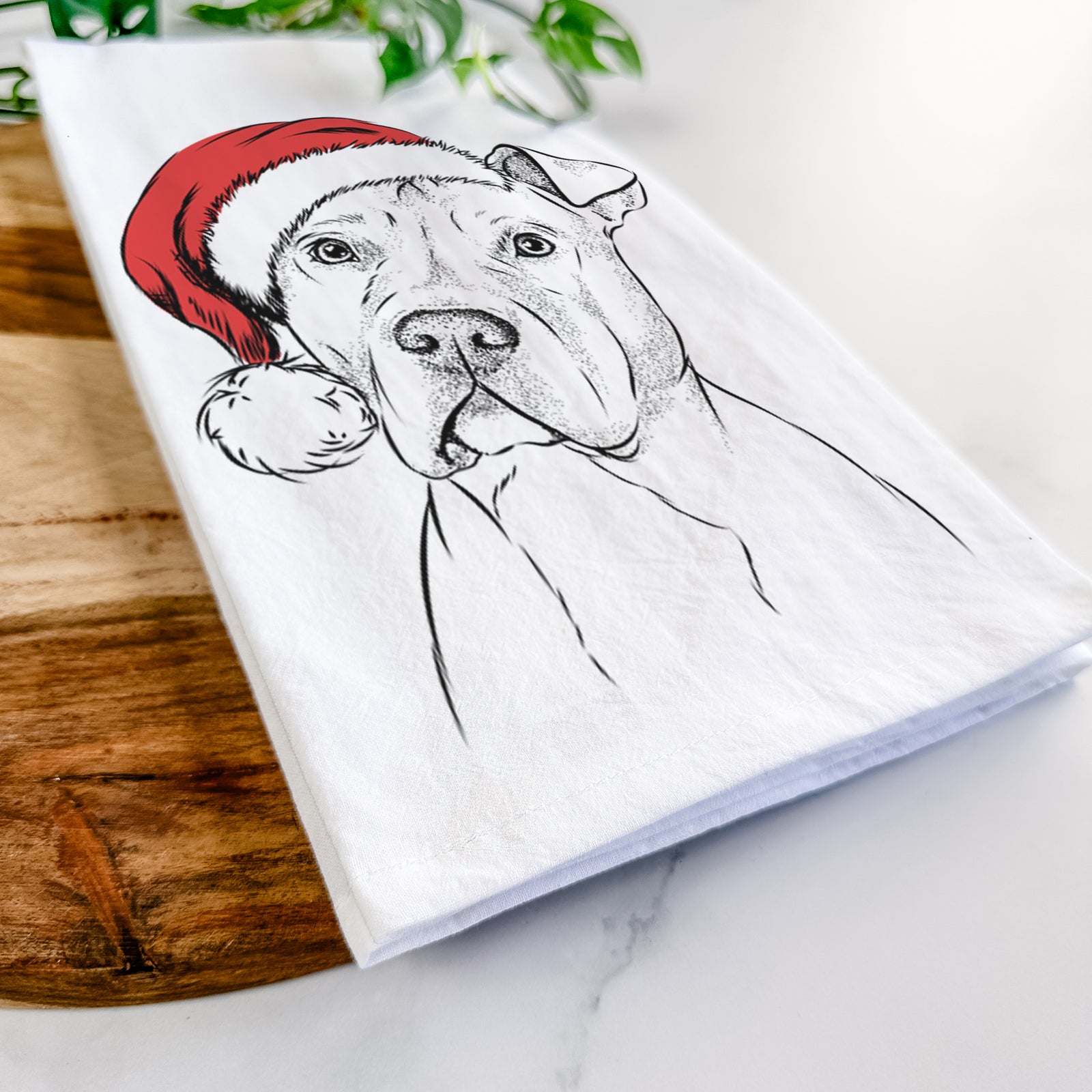 Hand-drawn sketch of Scraps the American Staffordshire Mix wearing a Santa hat on a tea towel