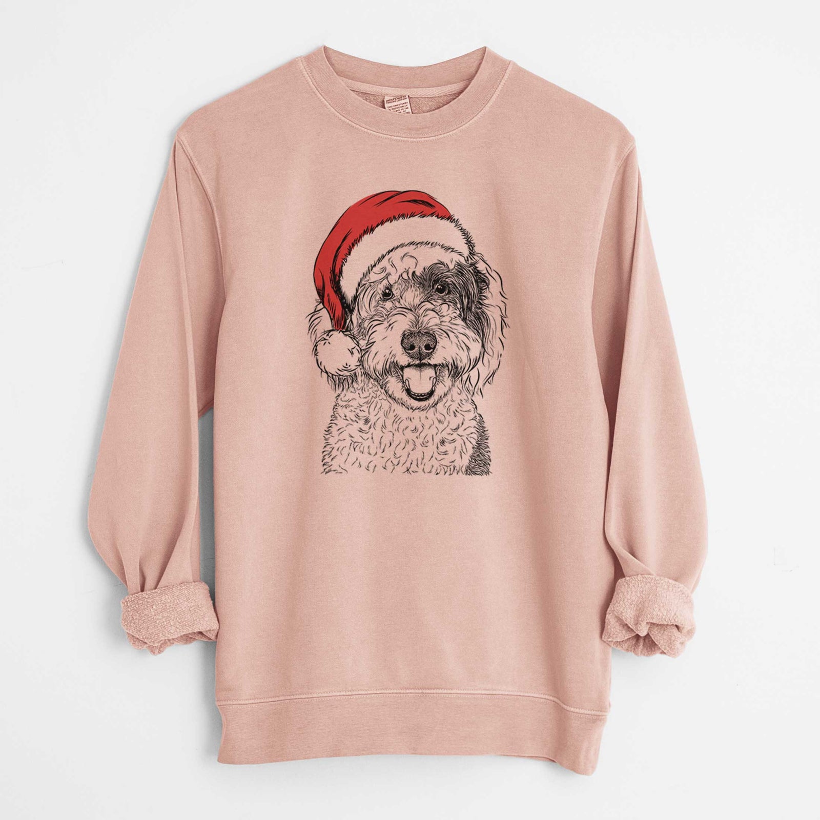 Hand-drawn sketch of Sherlock the Sheepadoodle wearing a Santa hat on a Dusty Pink Unisex pigment dyed crew sweatshirt