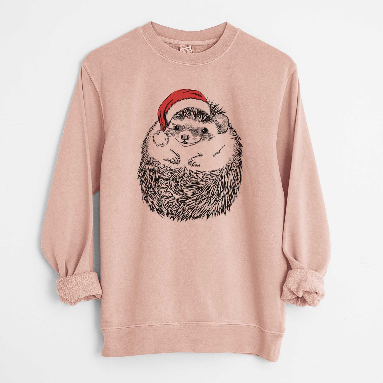 Hand-drawn sketch of Sid the Hedgehog wearing a Santa hat on a Dusty Pink Unisex pigment dyed crew sweatshirt