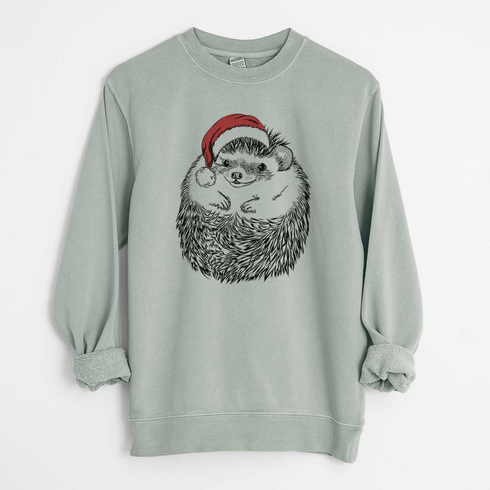 Hand-drawn sketch of Sid the Hedgehog wearing a Santa hat on a Sage Unisex pigment dyed crew sweatshirt
