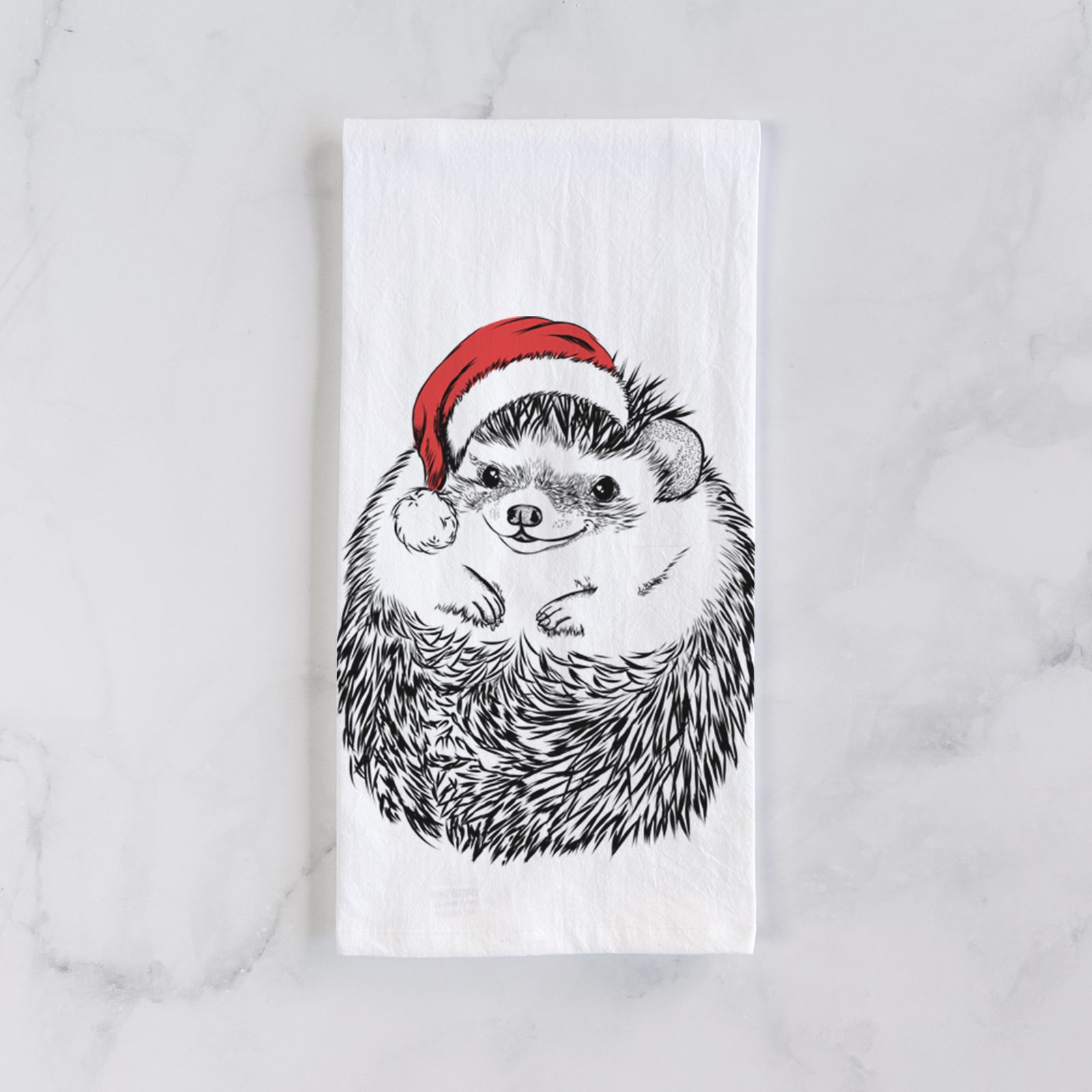 Hand-drawn sketch of Sid the Hedgehog wearing a Santa hat on a tea towel