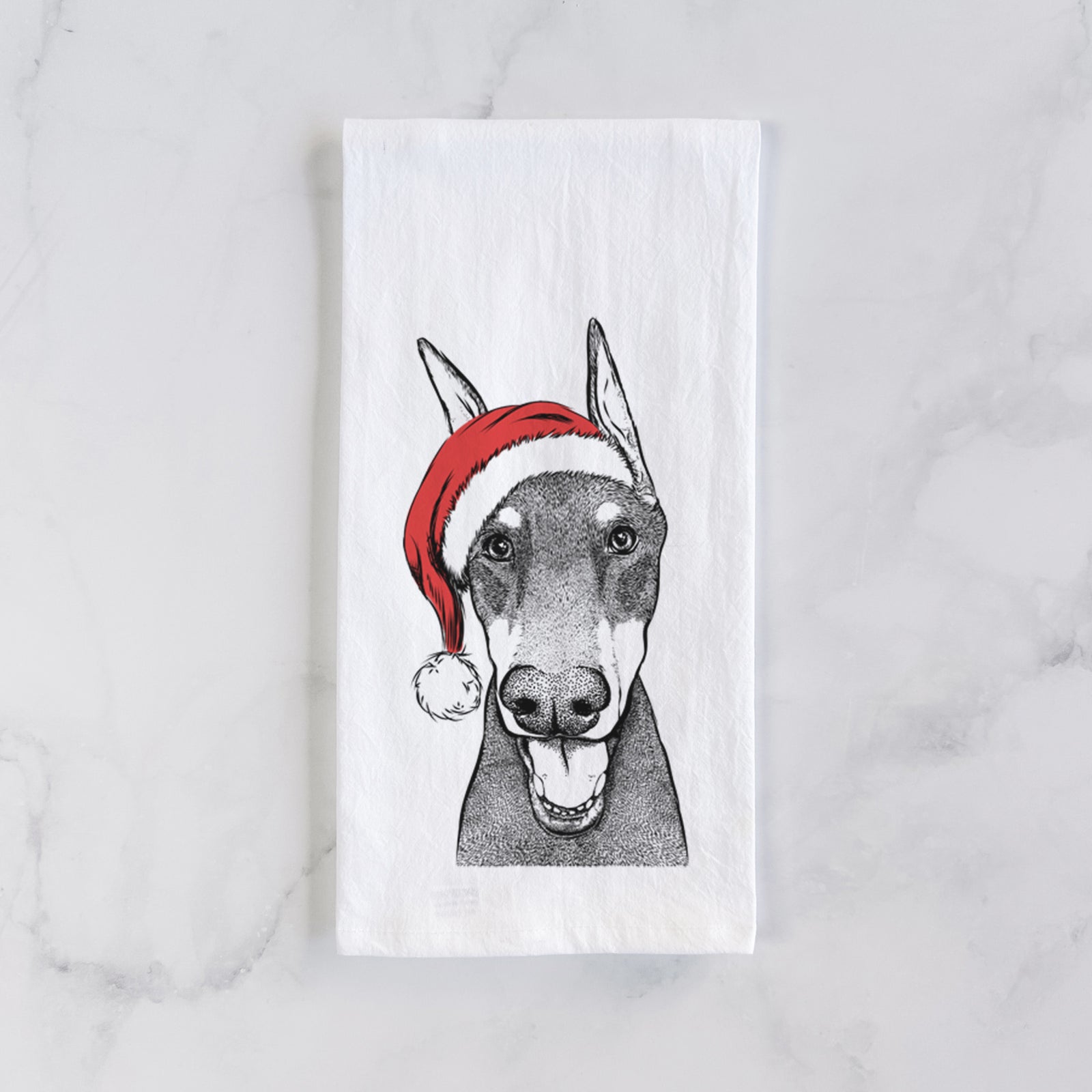 Hand-drawn sketch of Sir Duke the Doberman Pinscher wearing a Santa hat on a tea towel