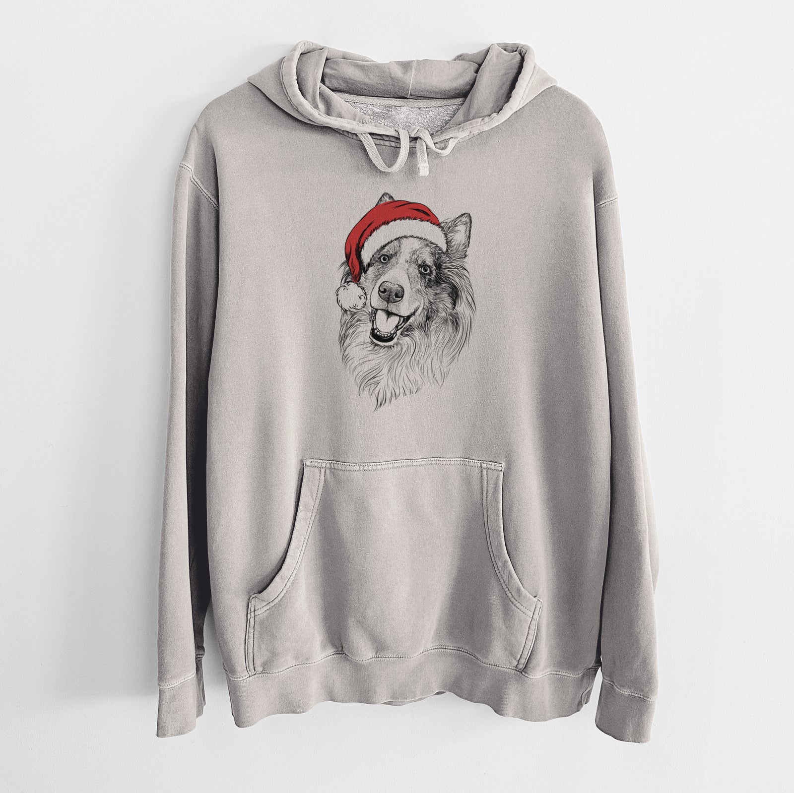 Hand-drawn sketch of Skylar the Shetland Sheepdog wearing a Santa hat on a Cement Unisex pigment dyed hoodie