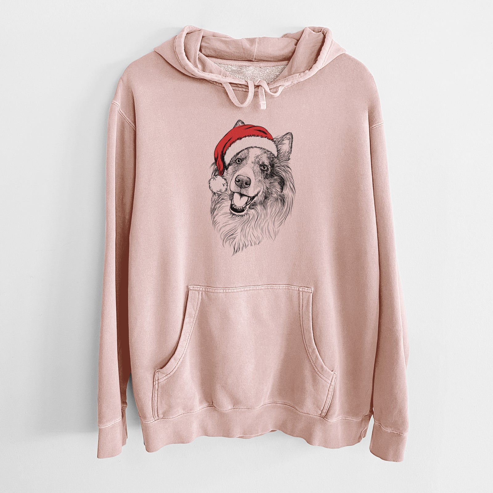 Hand-drawn sketch of Skylar the Shetland Sheepdog wearing a Santa hat on a Dusty Pink Unisex pigment dyed hoodie