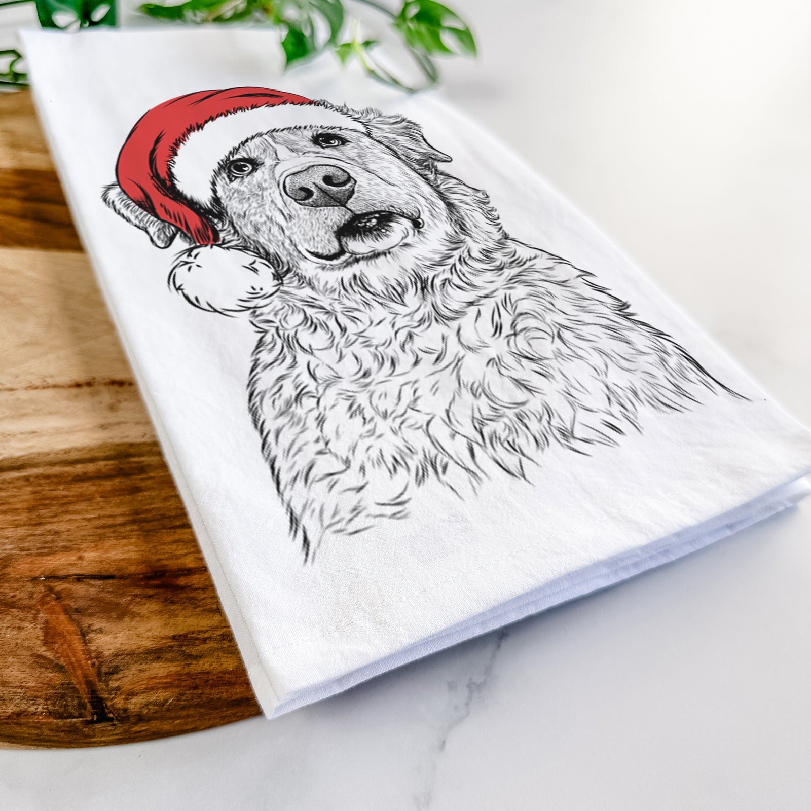 Hand-drawn sketch of Smokey Jam the Middle Eastern Village Dog wearing a Santa hat on a tea towel