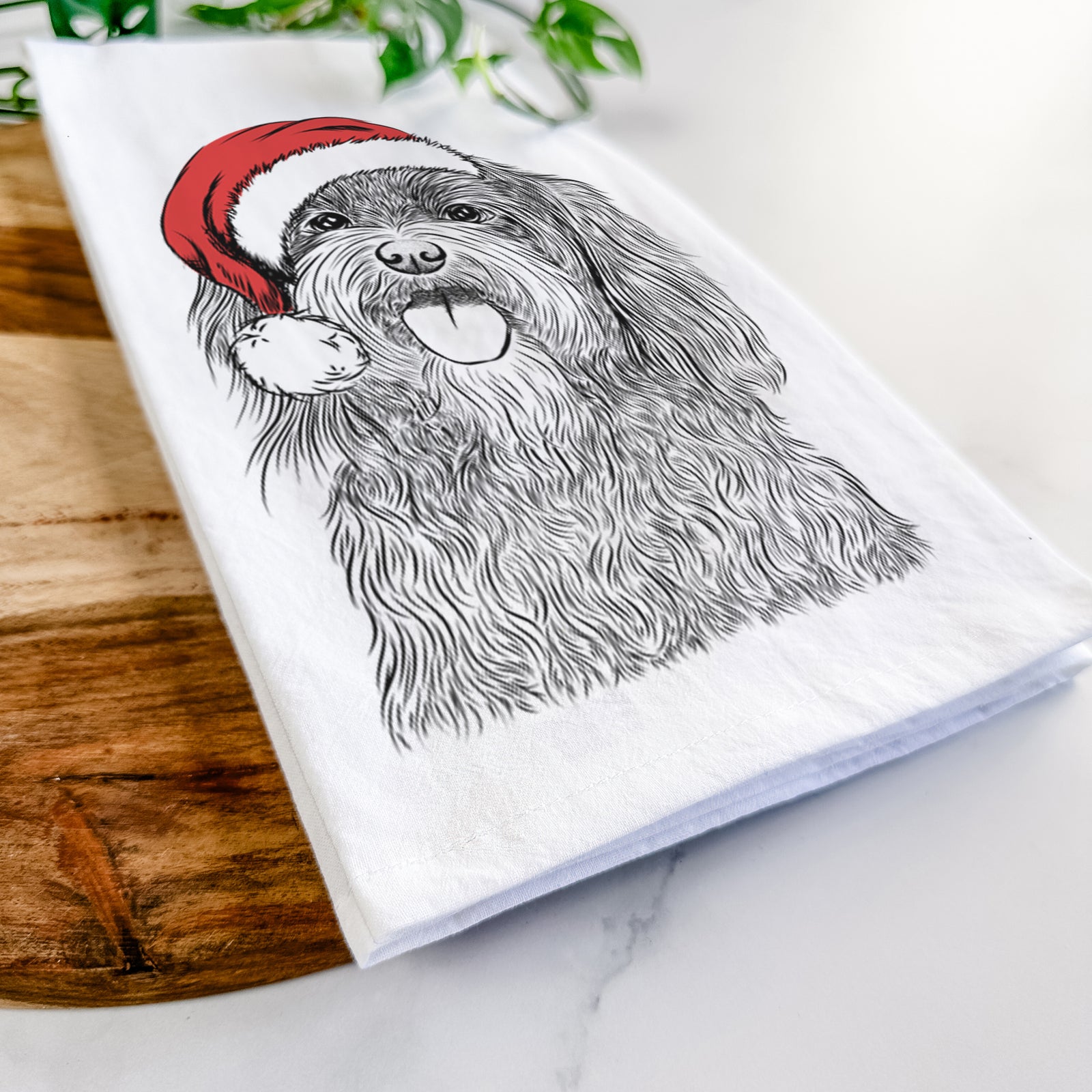 Hand-drawn sketch of Sophie the Havanese wearing a Santa hat on a tea towel
