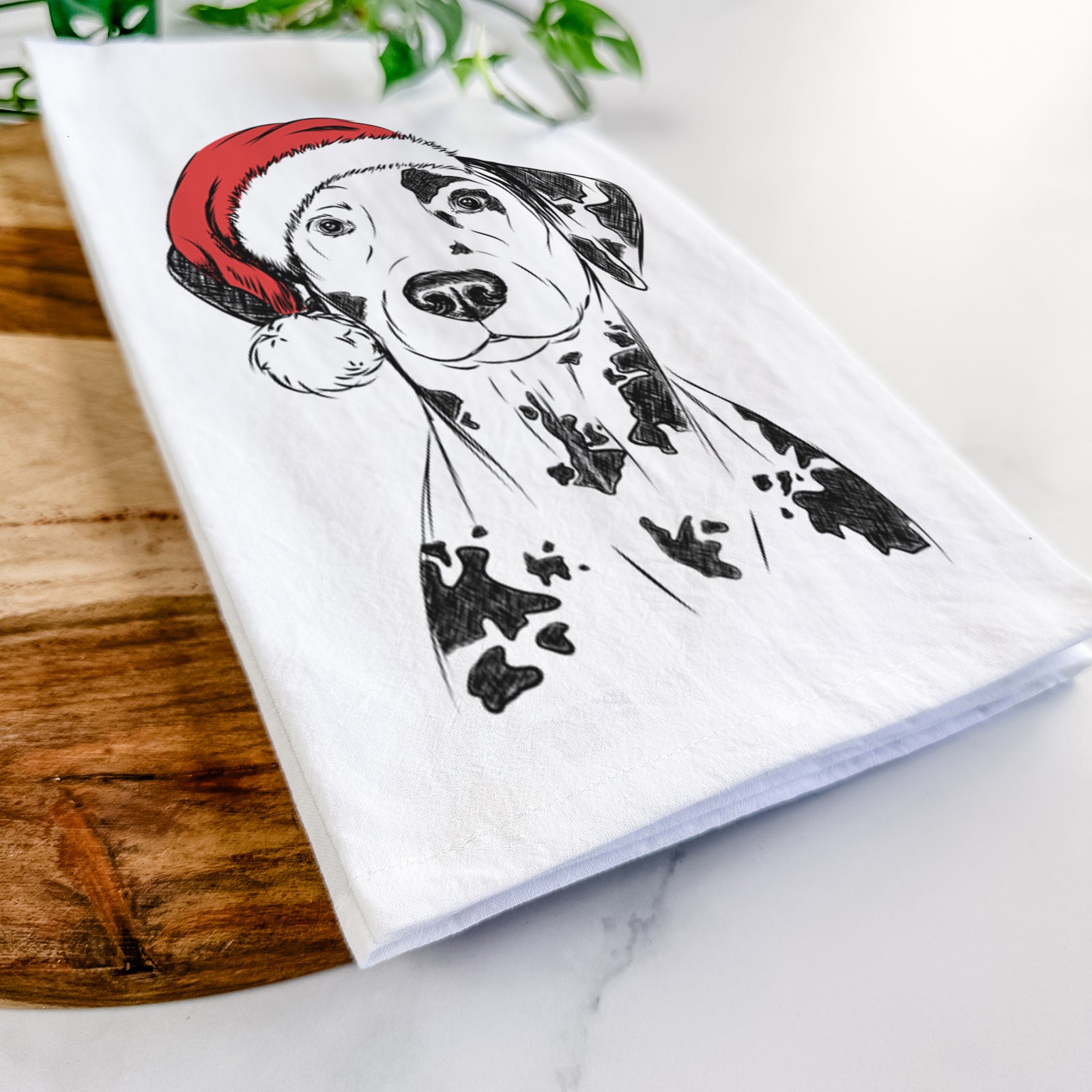 Hand-drawn sketch of Spot the Dalmatian wearing a Santa hat on a tea towel